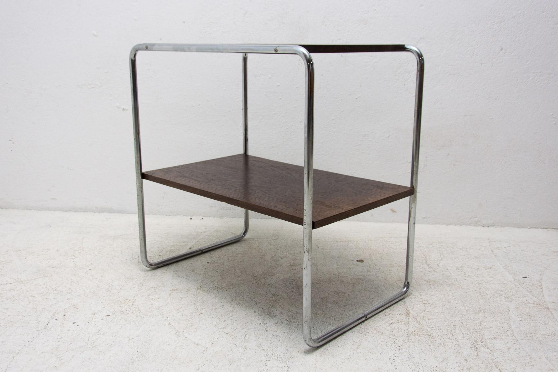 Chromed side table by Marcel Breuer

It was made during the Bauhaus period in the former Czechoslovakia in the 1930´s

It has a chrome base and two veneered plywood boards.

The table is in good Vintage condition, the chrome showing signs of
