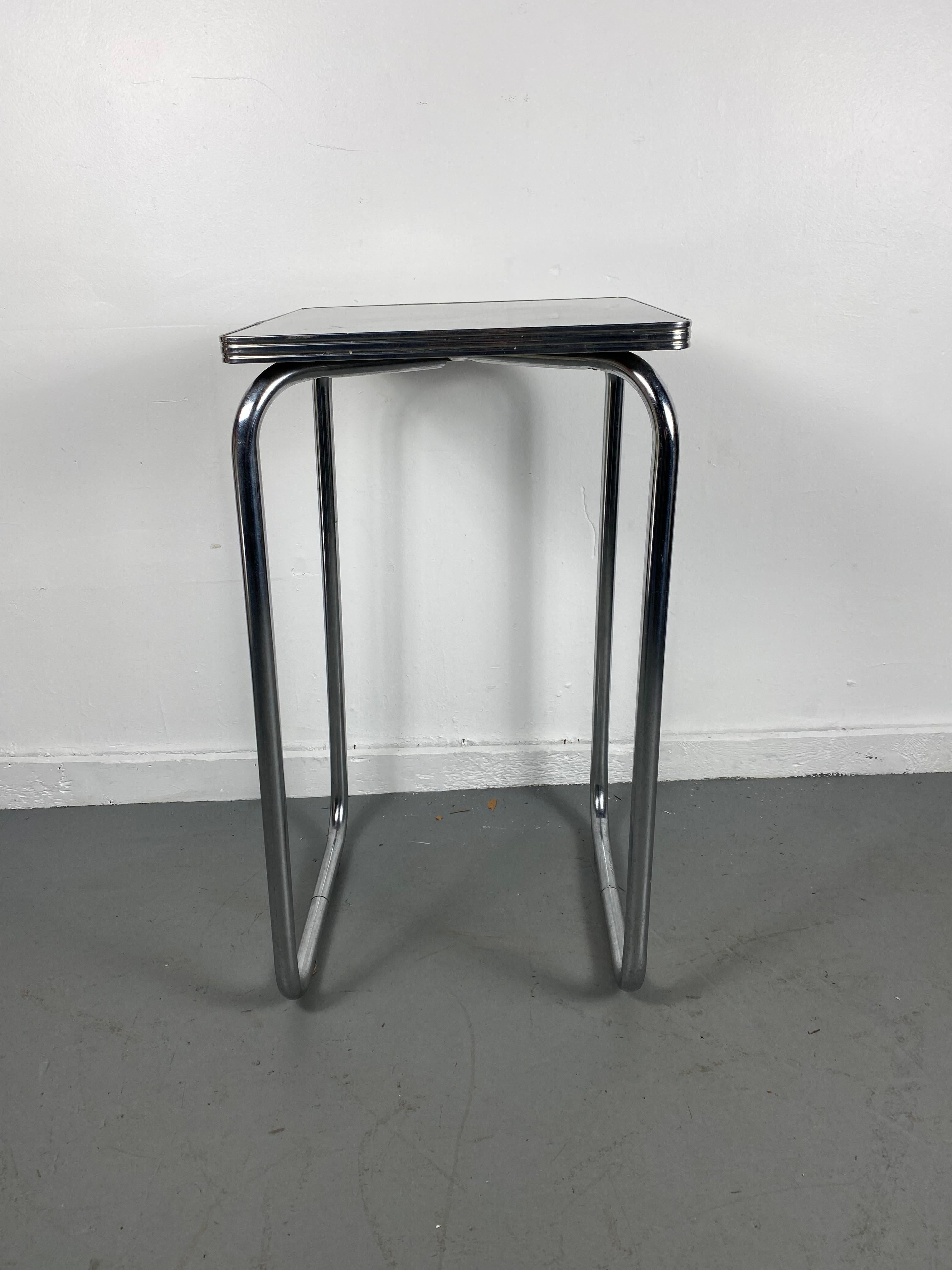 Unusual Bauhaus style black and tubular chrome table / stand / attributed to Wolfgang Hoffmann for Howell Furniture Company. Great size and proportion. Handsome under-stated design. Reminiscent of classic designs by Marcel Breuer, Mies Van der rohe.