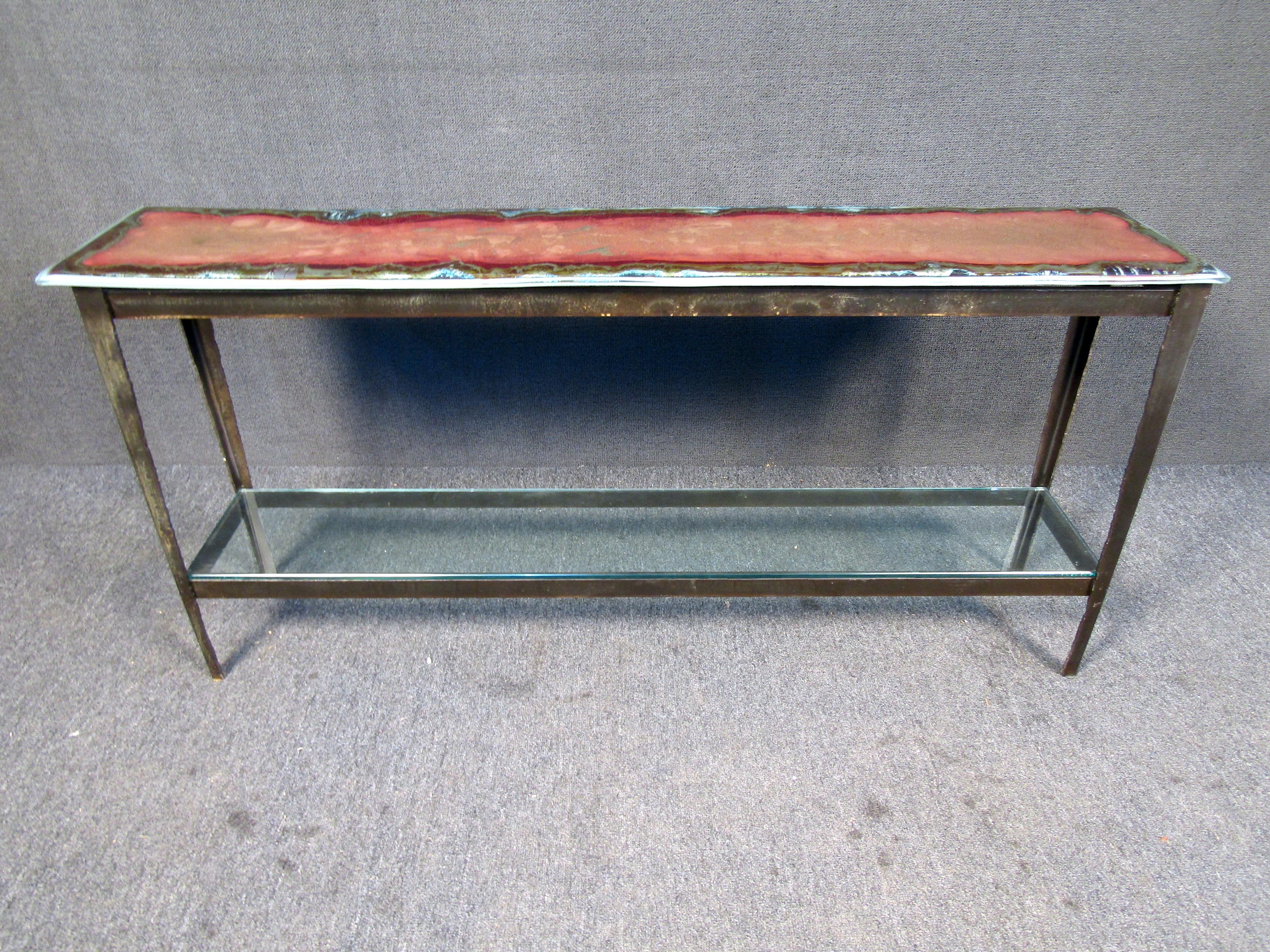 This unique blown glass coffee table comes with a sturdy metal base and vibrant multi-color glass top sure to capture your guests attention. 
Please confirm item location (NJ or NY).