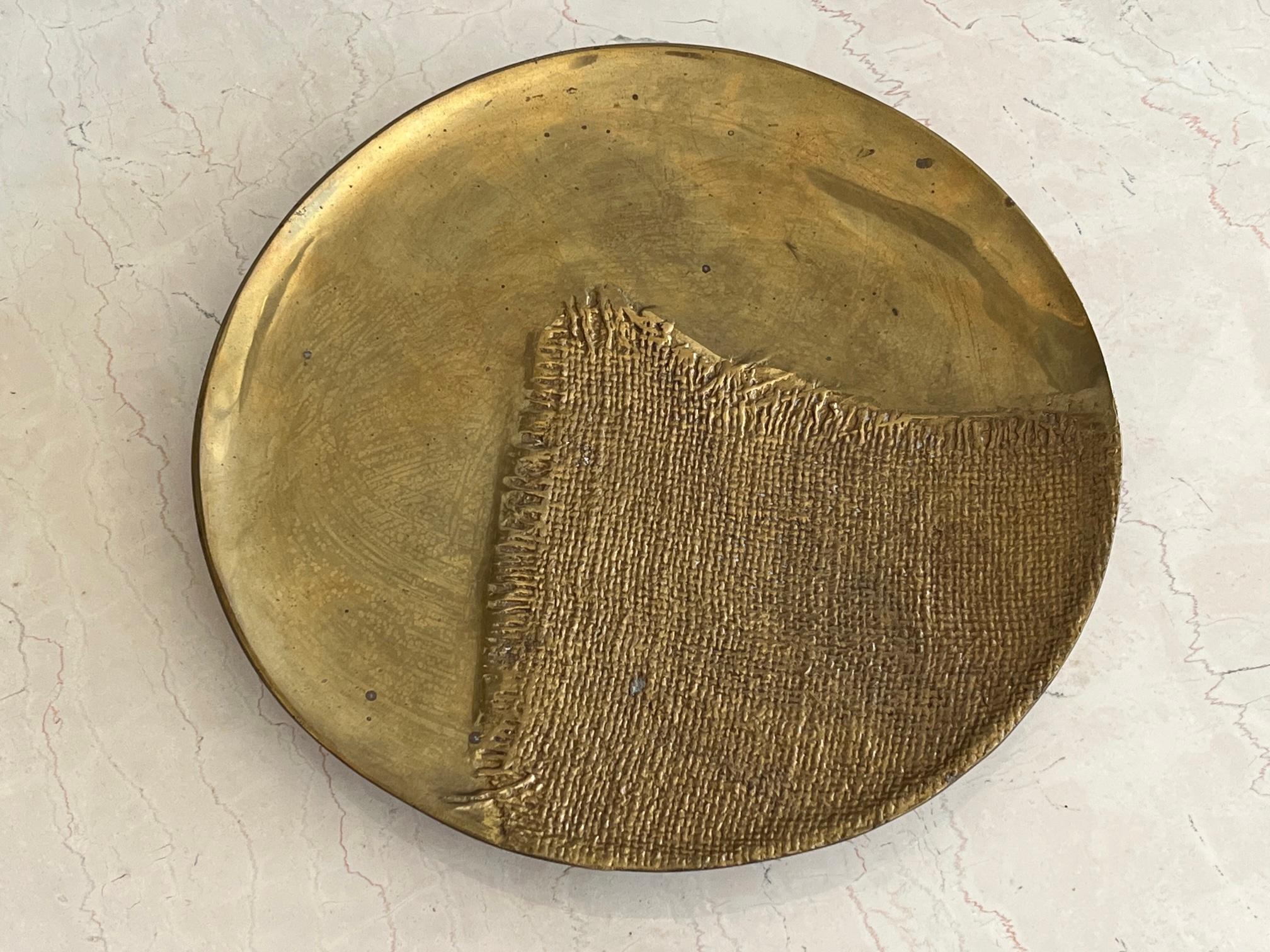 An unusual brass platter, handmade in India for AMC, New York. Really heavy and a nice patina.