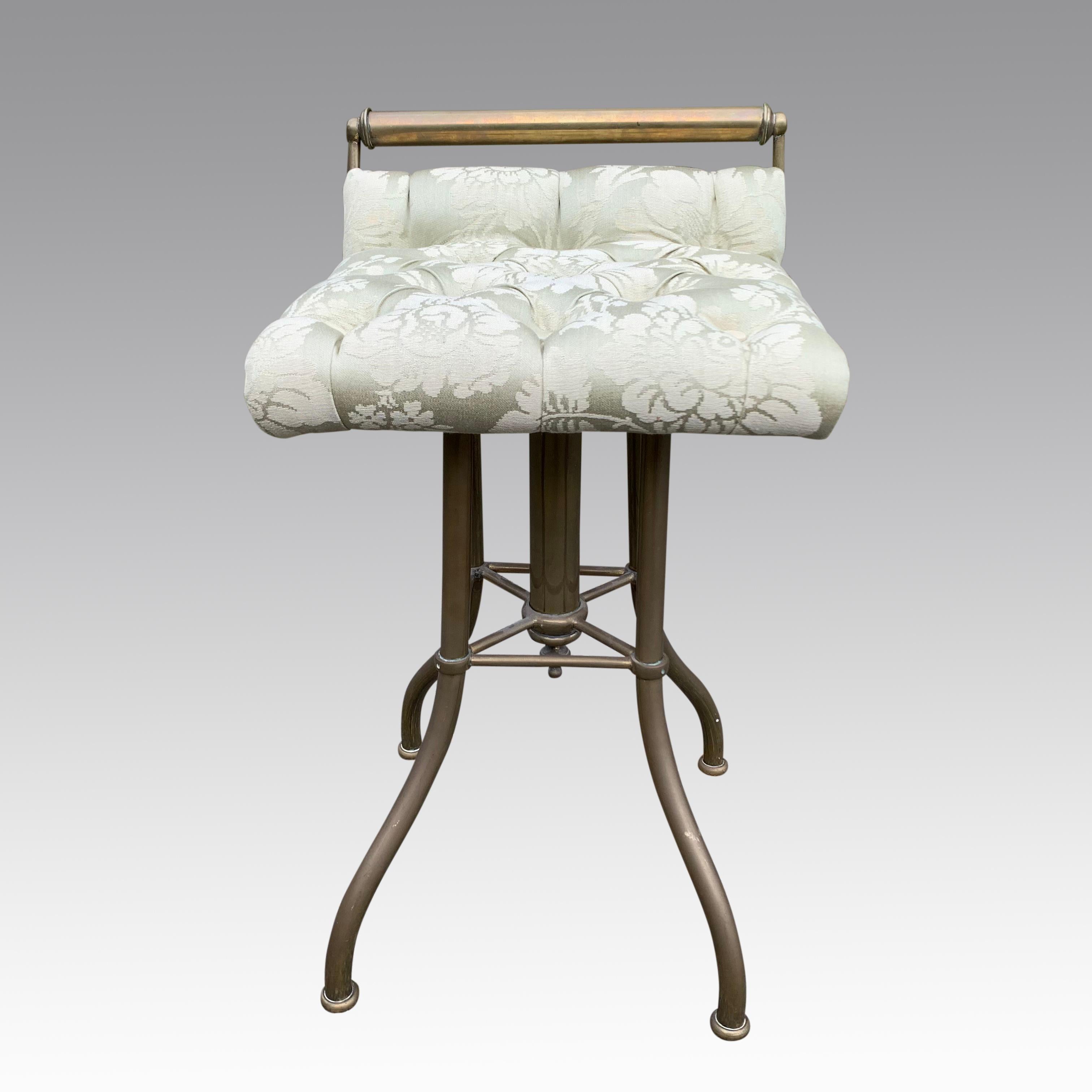 A most inusual and highly decorative brass framed music stool with height adjustable upholstered seat. Beautifully re-upholstered in a pale green, buttoned damask fabric. In excellent original condition.
Measures: Height from 56cms to 66cms.
