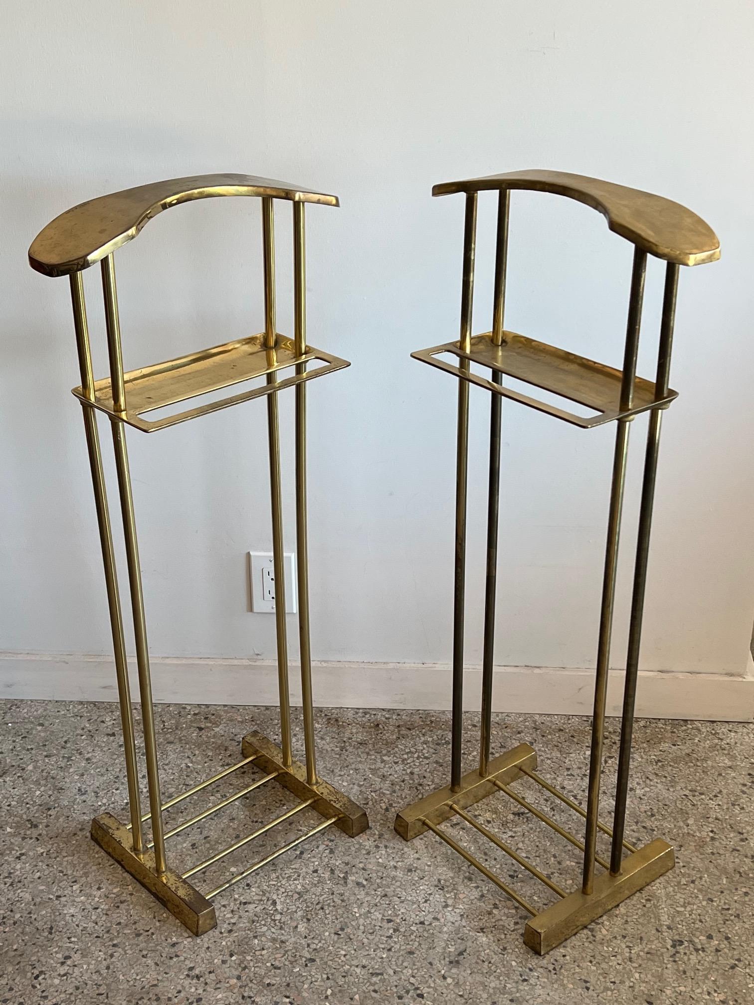 A pair of unusual brass valets, made in Taiwan ca' 1980's. Heavy construction with a clean modern style.