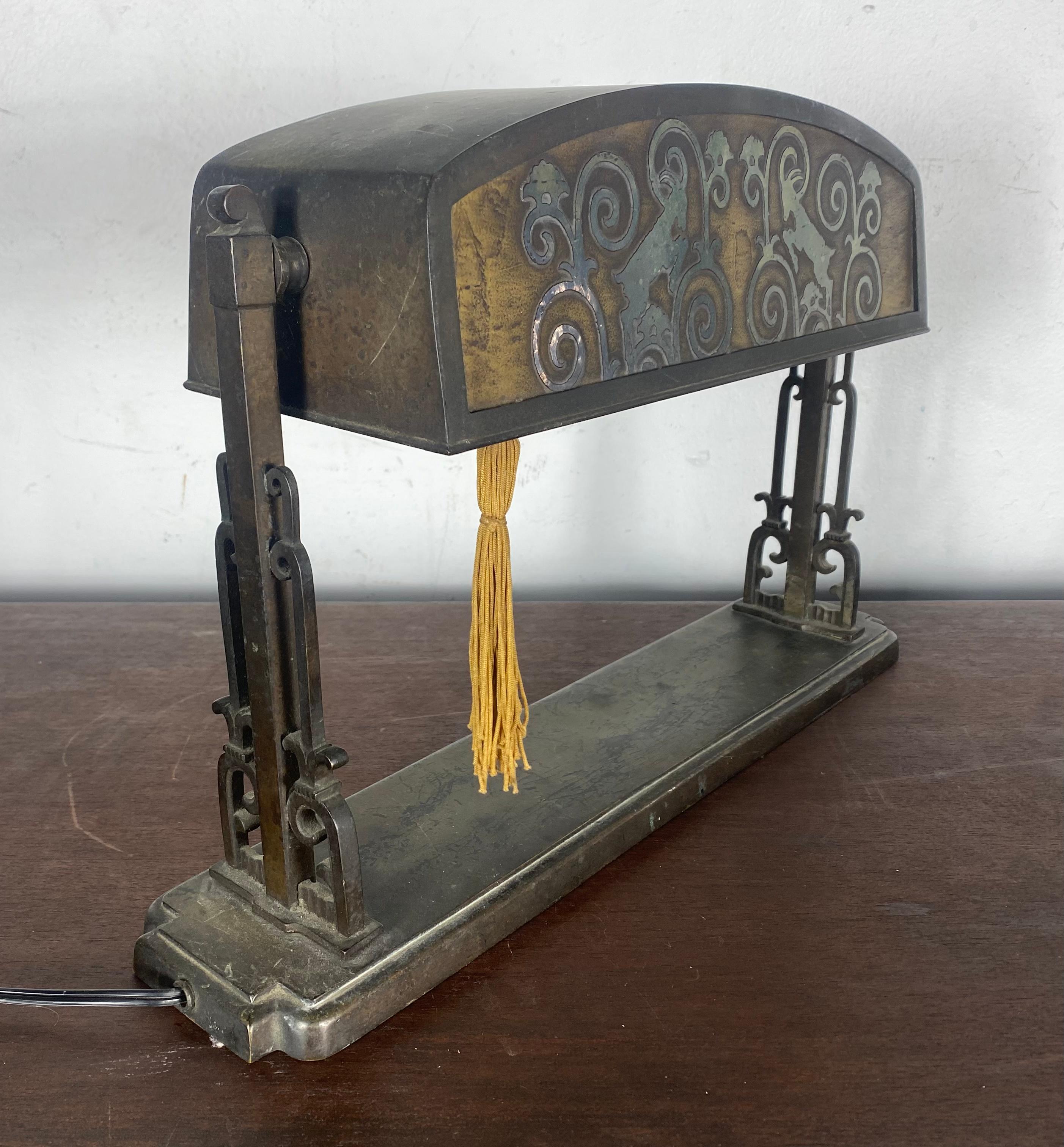 Unusual bronze & acid etched glass table / desk lamp, amazing stylized rams head motif. Retains its original patina. Color, surface, also original tassel pull on/off switch.