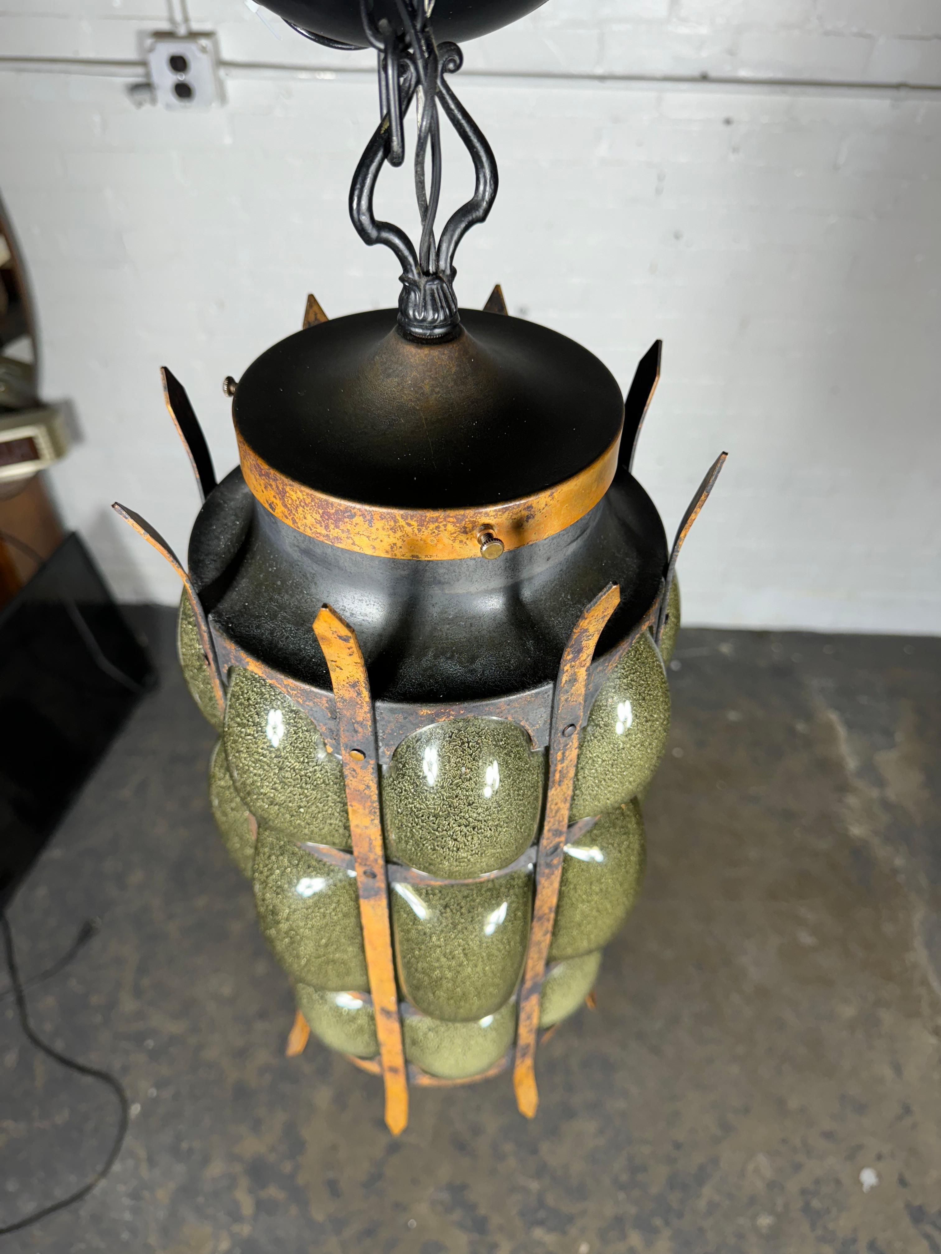Unusual Brutalist / Modernist Blown Glass and Iron Hanging Pendant Lamp by MOE lighting, Gold iron frame,, wonderful crackle glass.. Great color,, 