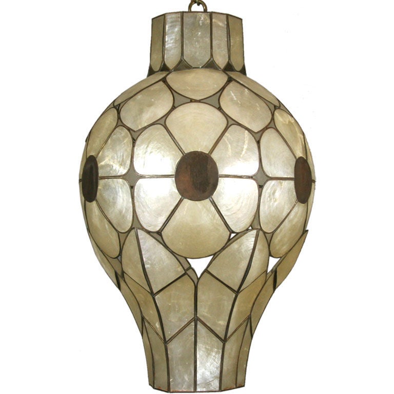 #1-2230a shaped capiz shell with leaves and floral design.
Take one 100 watt Edison based bulb.
Imperfections in shell

  