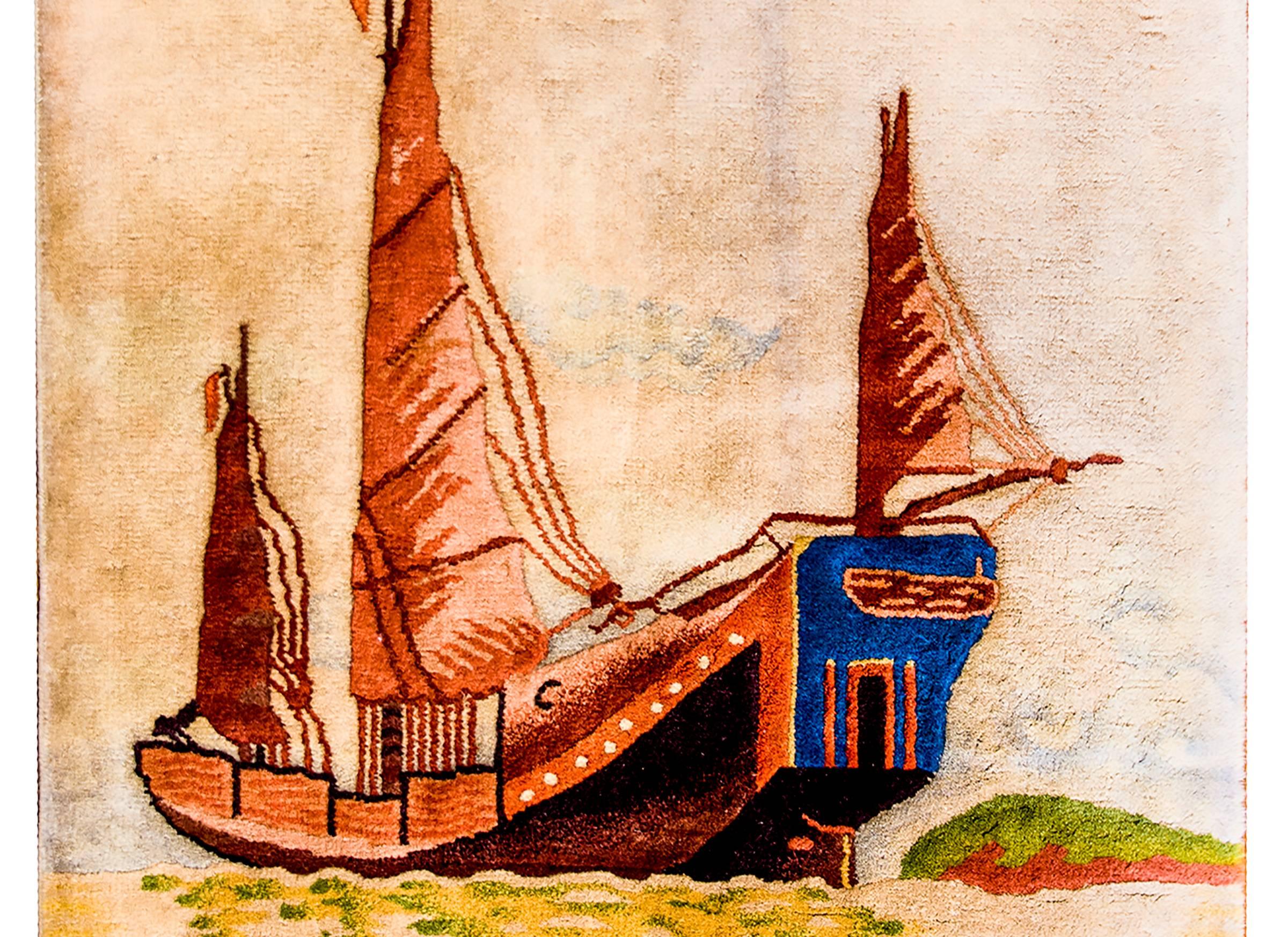 An unusual Chinese Art Deco Rug with a large Chinese Junk ship, sea sailing vessels used by the Chinese since the Song Dynasty, woven with a sophisticated multi colored background and no border.