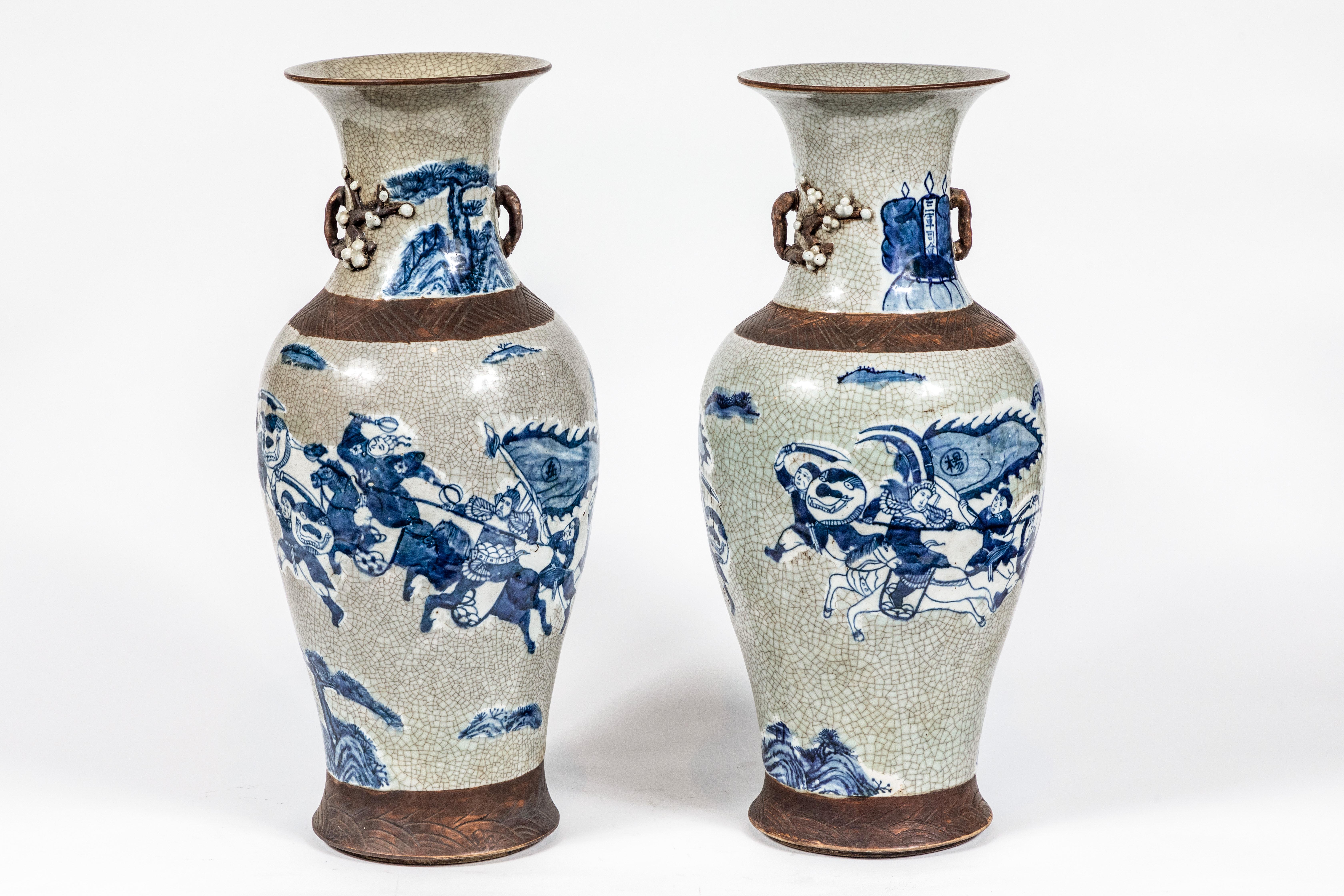 Pair of beautifully made, hand painted, gray-ground, craqueleur-glazed urns featuring incised clay bands and sculpted, willow-branch armatures.