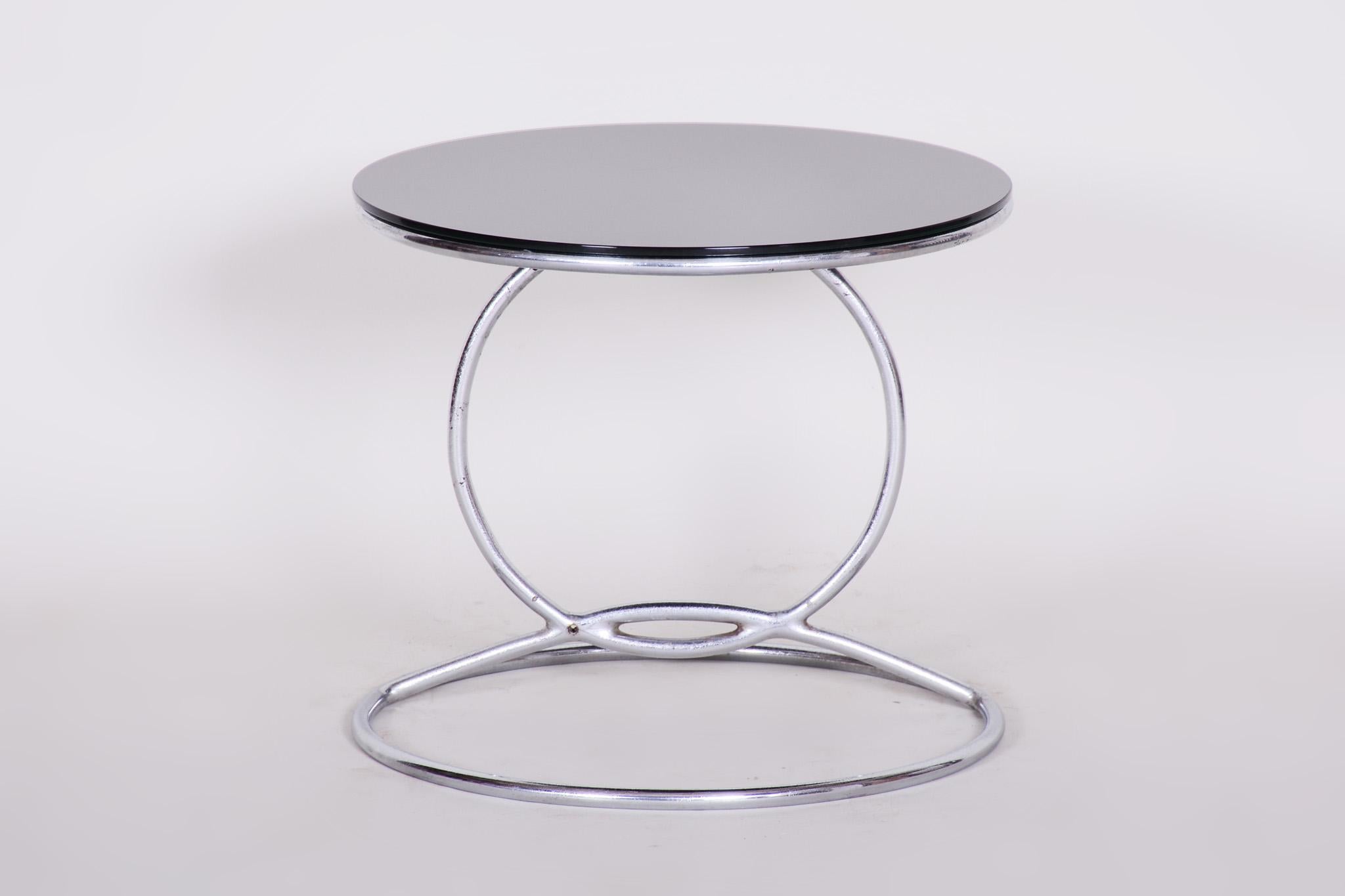 Bauhaus round table
Source: Germany
Original really good condition.
Material: Chrome and Black glass
Period: 1950-1959





 