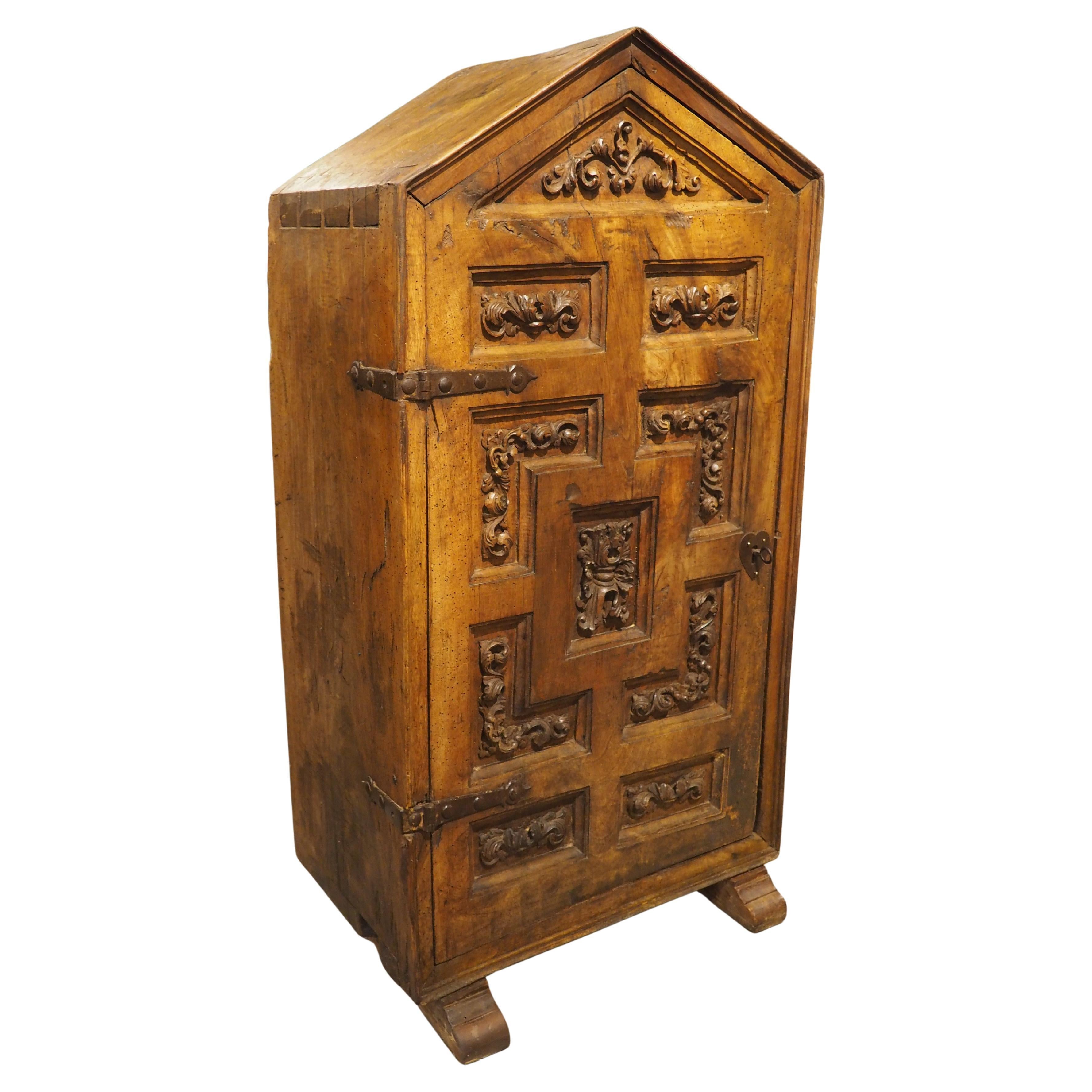 Unusual Circa 1650 Solid Walnut Carved Single Door Cabinet from Spain im Angebot