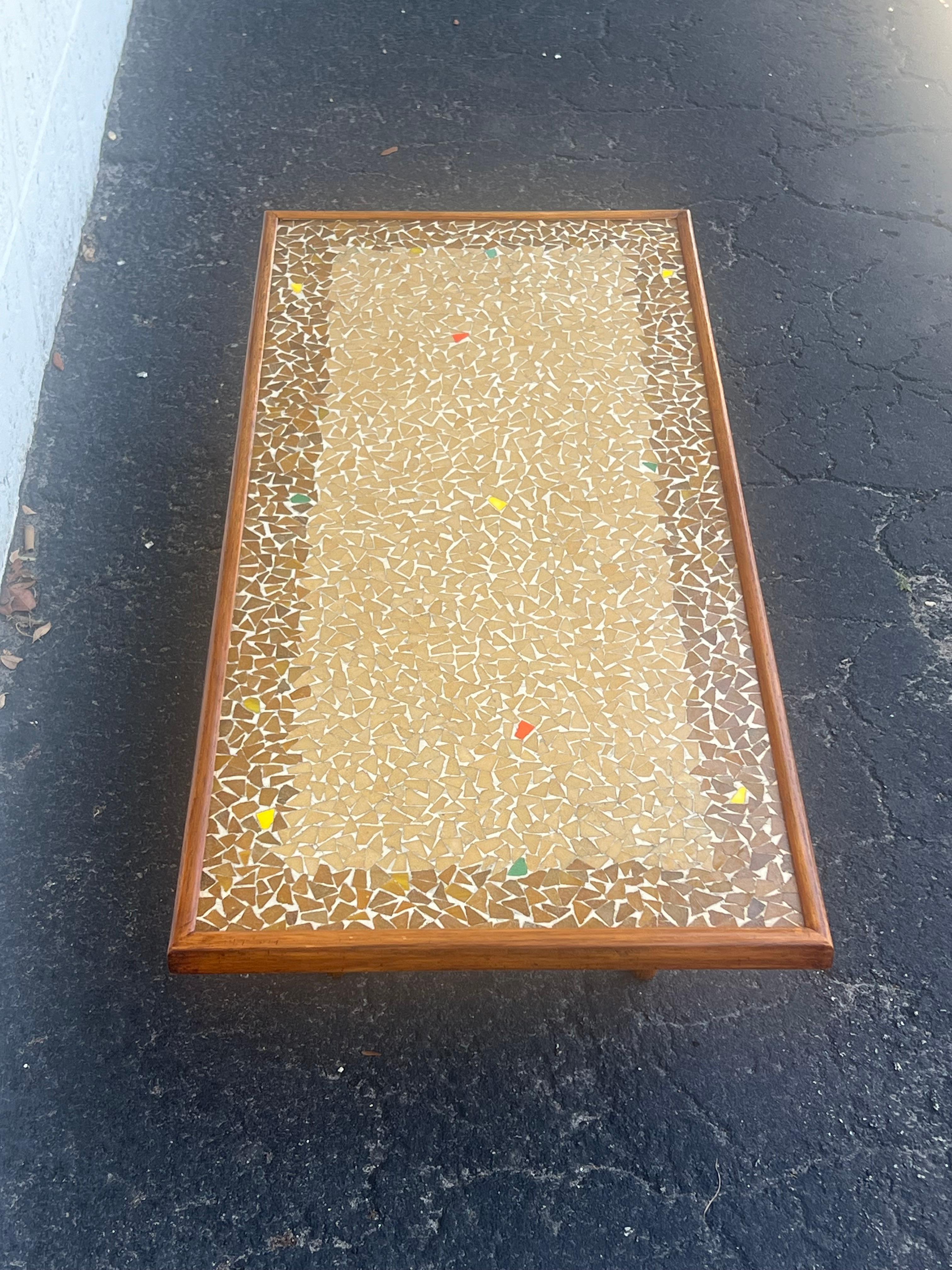 An unusual, coffee table with a mosaic tile top, ca' 1950's. Oak frame and legs.