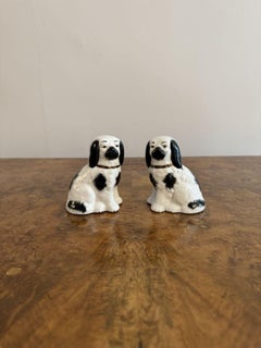 Unusual collection of five antique Staffordshire dogs