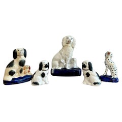 Unusual collection of five Used Staffordshire dogs 