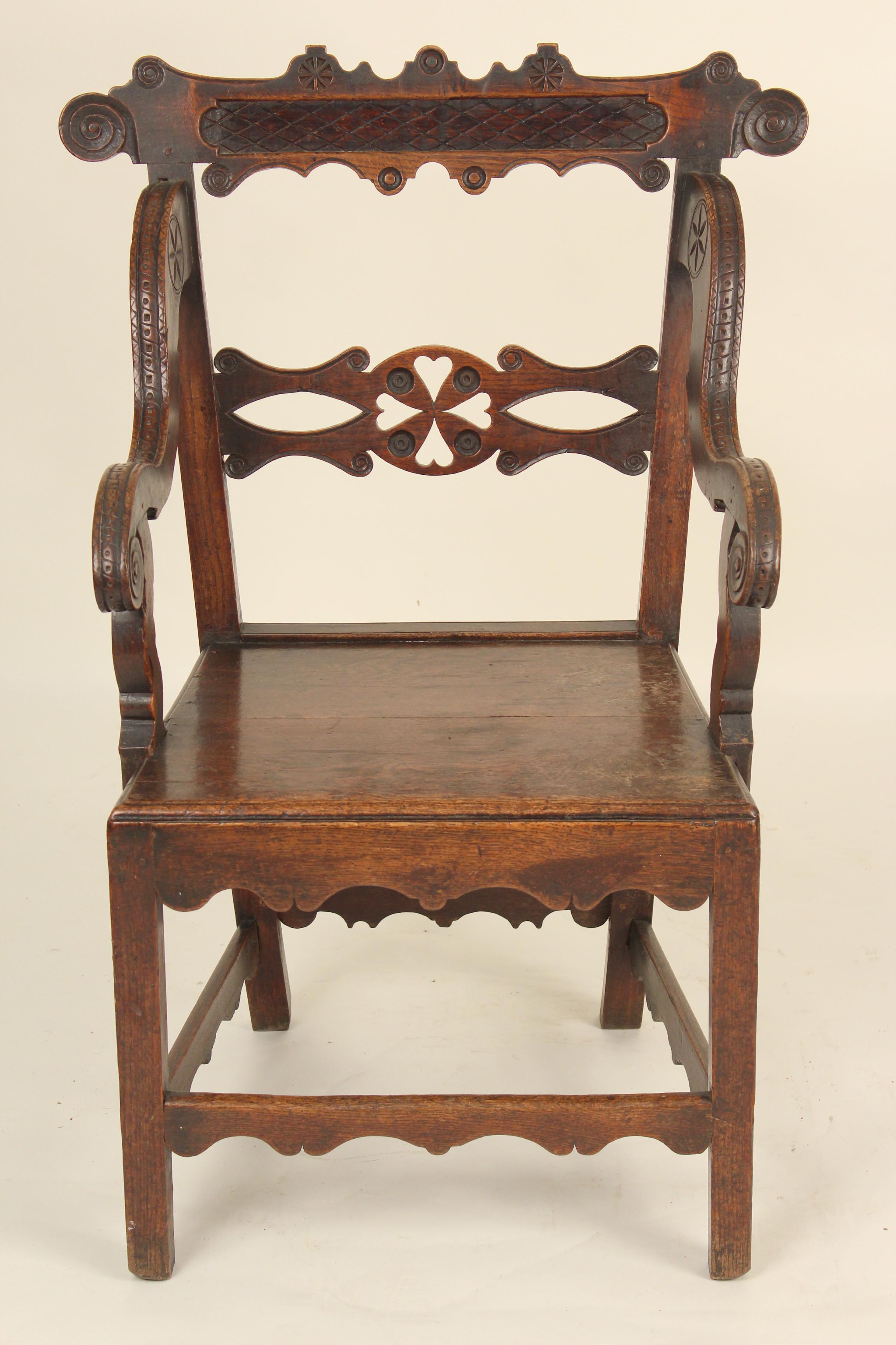 Unusual country English oak armchair, circa 1828. Inscription on the back of the crest rail reads 