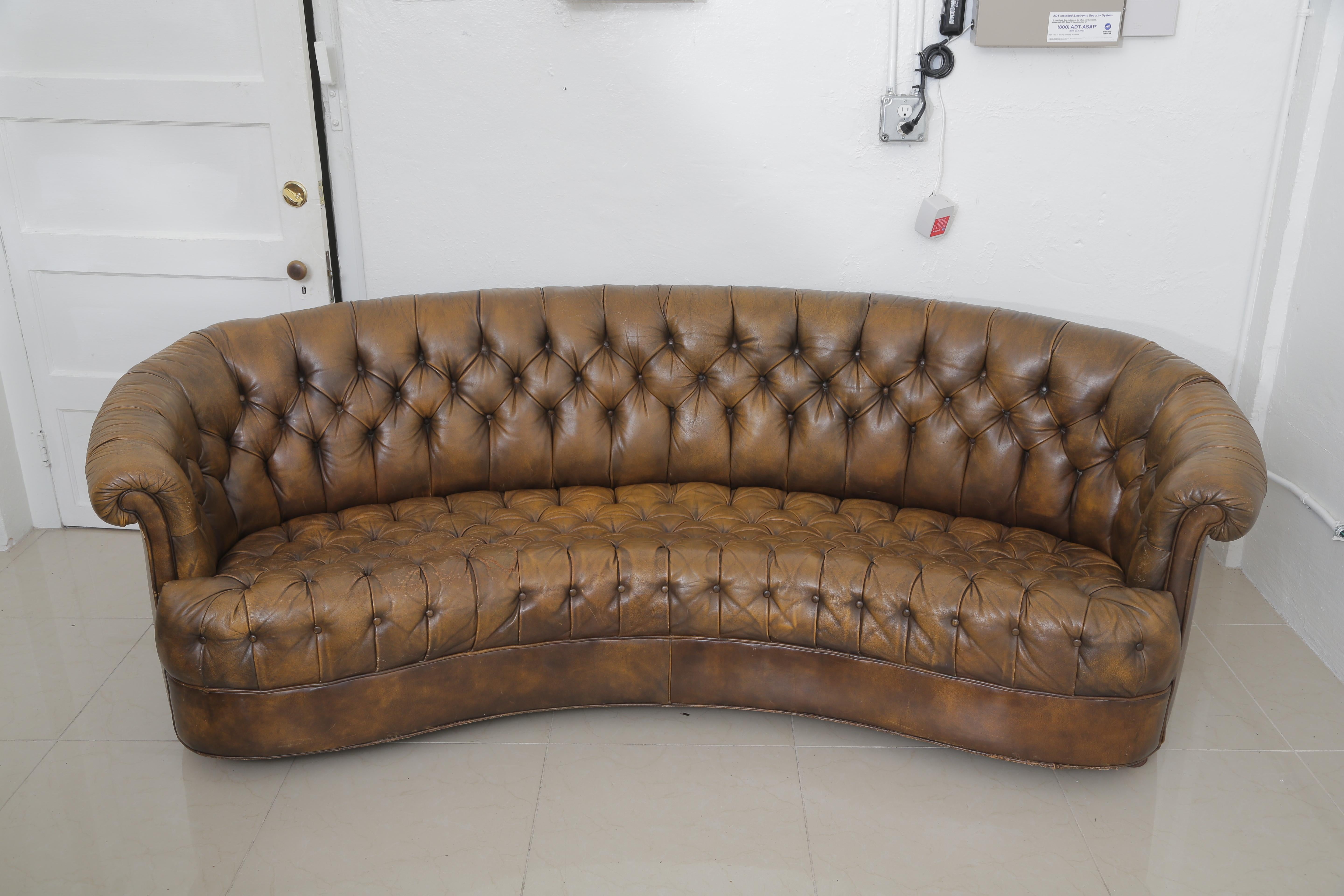 Vintage chesterfield leather sofa and chair on wheels.