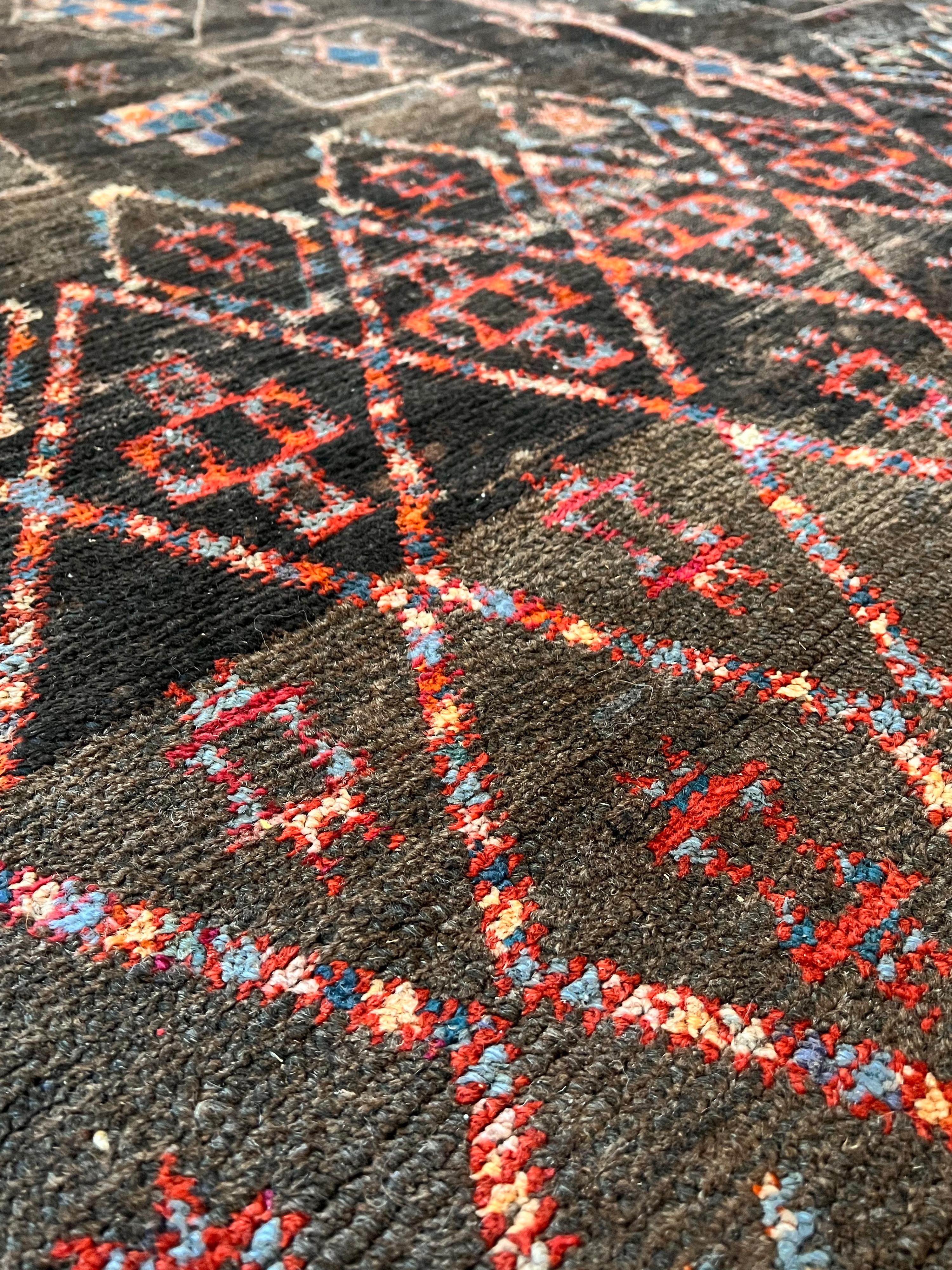 Tribal Unusual dark toned vintage Beni M'Guild carpet curated by Breuckelen Berber For Sale