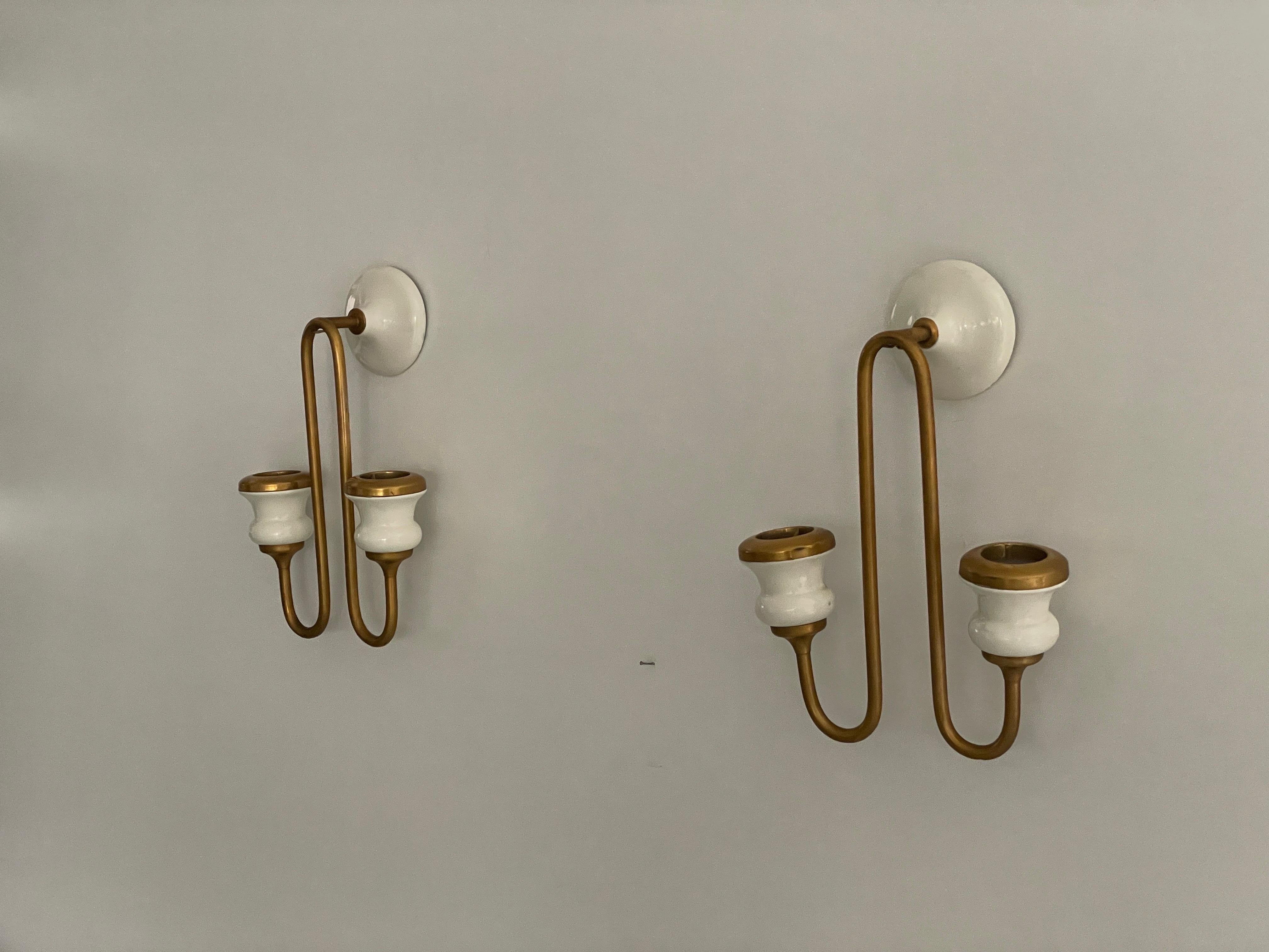 Unusual Design Ceramic and Metal Sconces in Candlestick Form, 1950s, Italy

Very nice high quality wall lamps.

Lamps are in very good vintage condition.


These lamps works with 2x E14 standard light bulbs. 
Wired and suitable to use in all