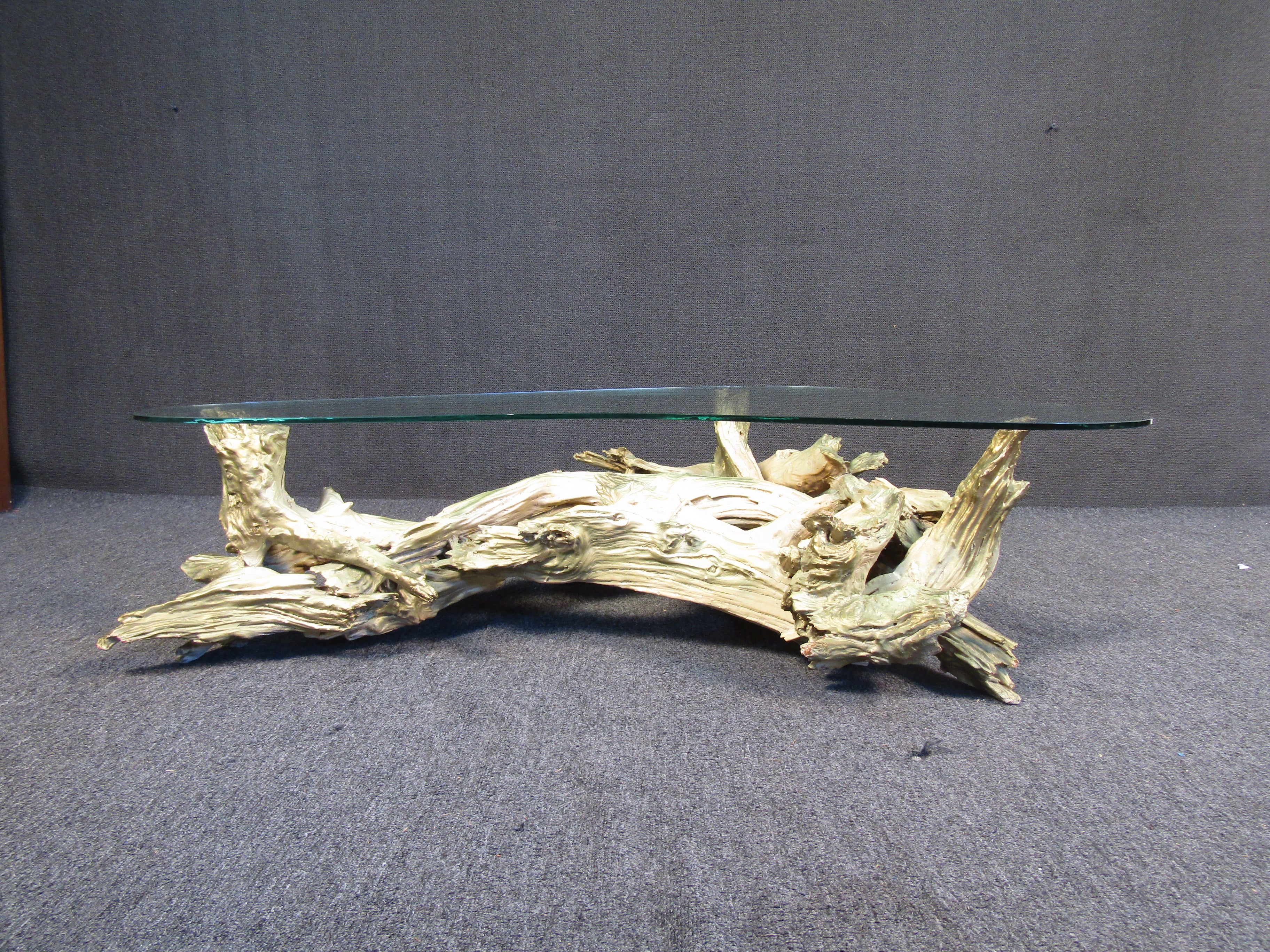 Unique drift wood table featuring an unusual boomerang glass top. This table could be a great addition to any office or living space. 



Please confirm item location with seller (NY/NJ).