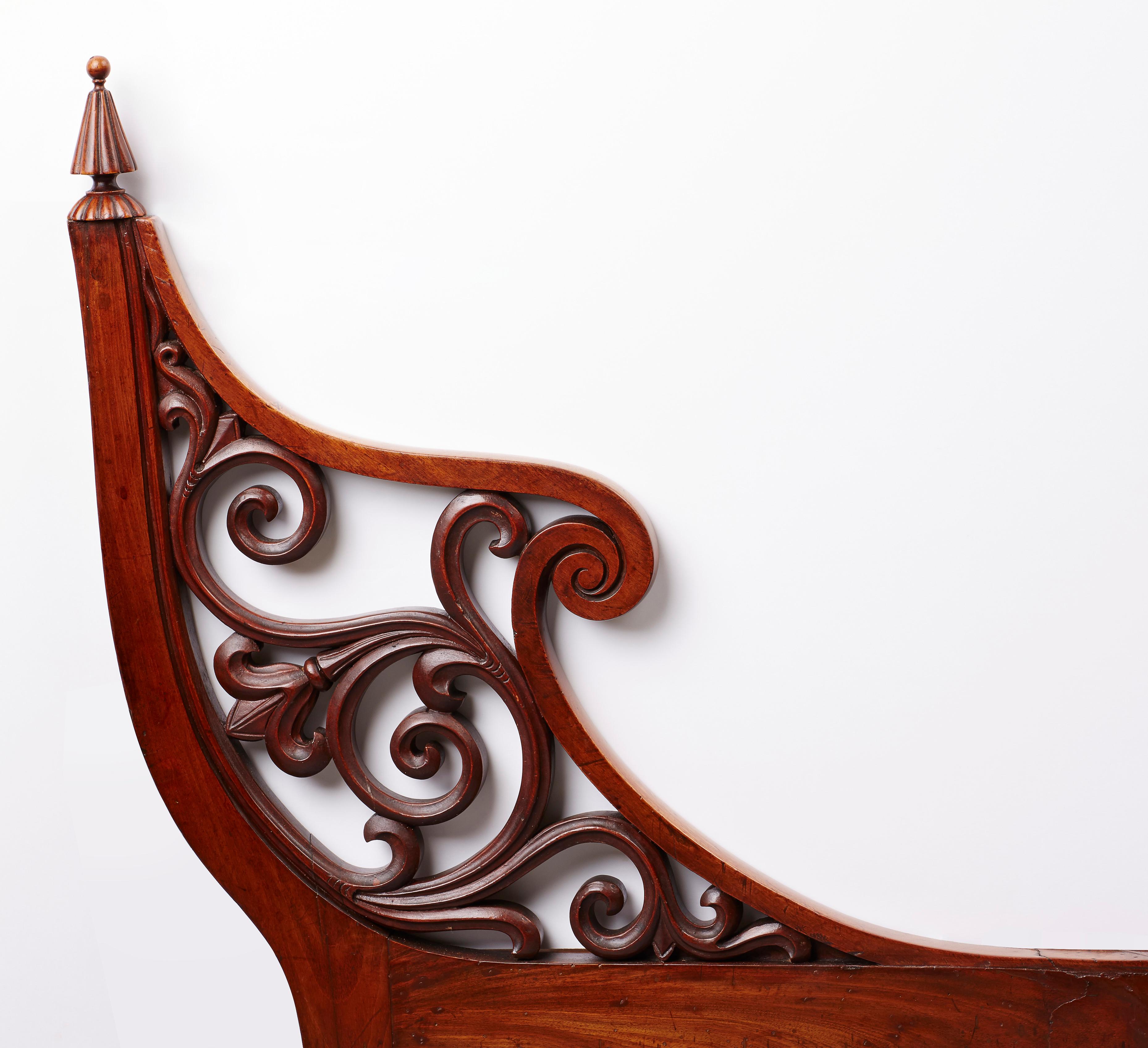 This chair is of highly elaborate design and exceptional craftsmanship. Open arms enclosing ornamental stylized foliage. Pierced turned reeded front legs, drop in seat and padded back covered in horsehair. 

The unusual design of this Biedermeier