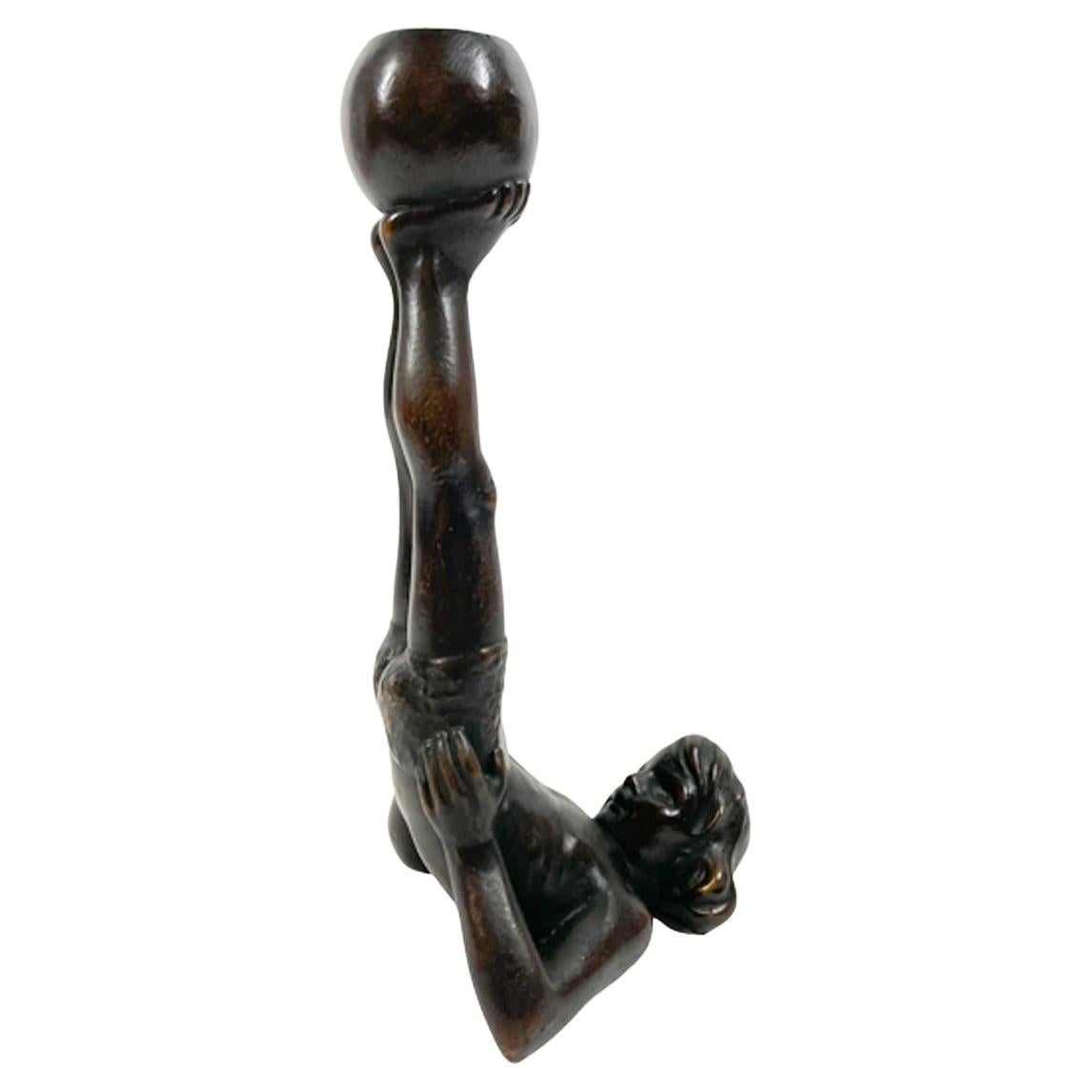 Unusual Early 20th C Figural Candlestick of a Boy Holding a Ball on His Feet For Sale
