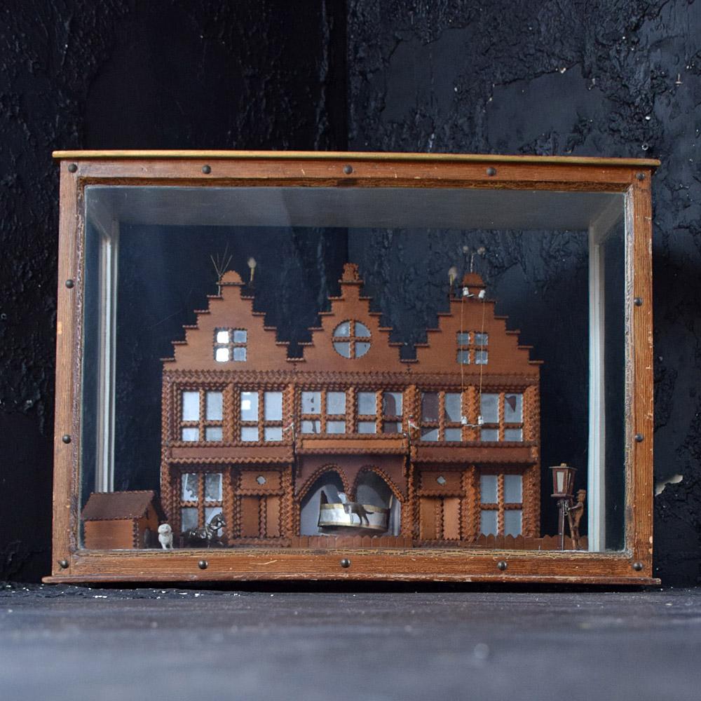 Unusual Early 20th Century Tramp Art Barometer Diorama
One of the most unusual pieces of early 20th century American tramp art we have had the privilege to uncover. Encased in a late 19th century glass and pine diorama sits a hand carved model of a