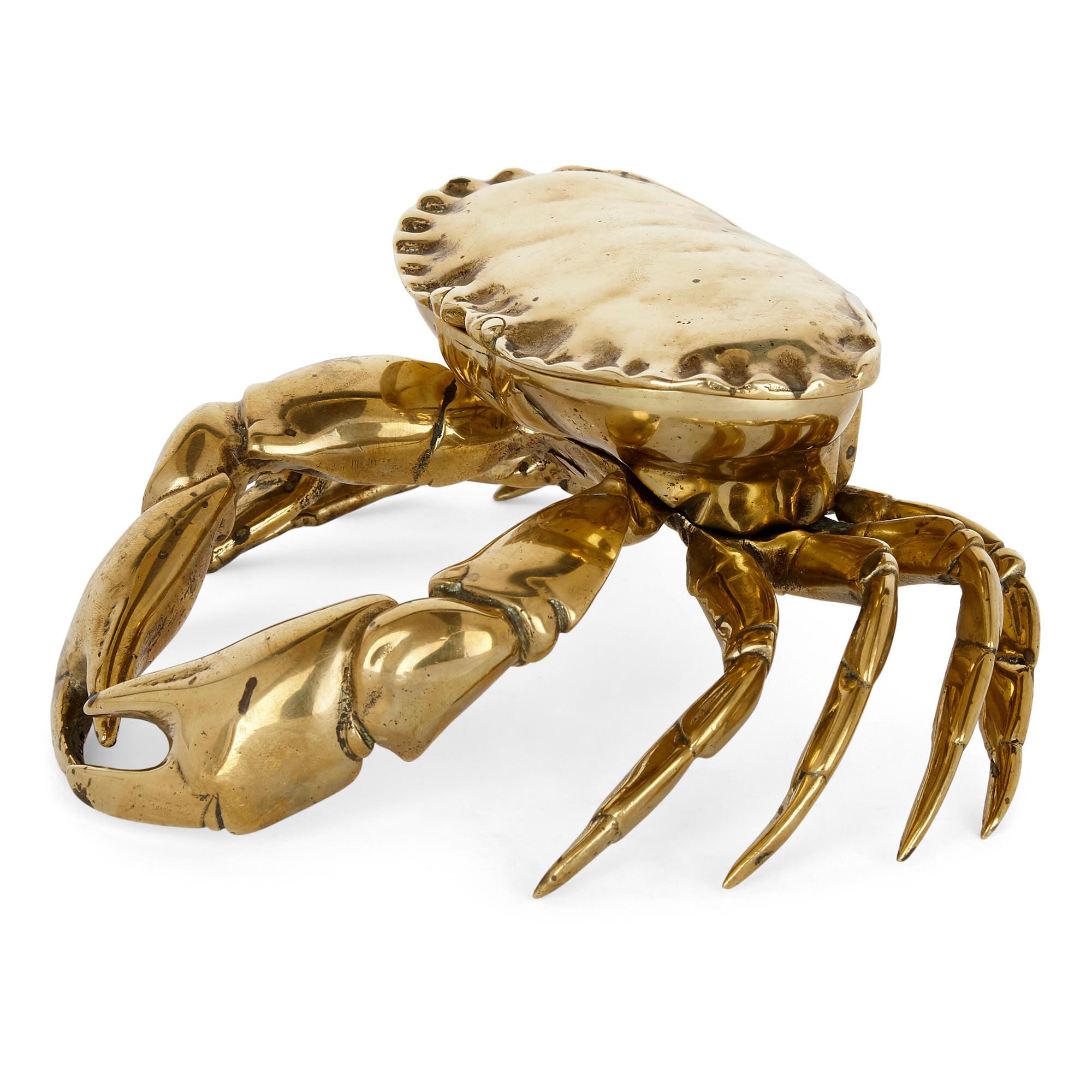 Unusual English crab-shaped brass inkstand
English, late 19th century
Measures: Height 8cm, width 18cm, depth 17cm

This charming brass inkstand takes the form of a naturalistically modelled crab. The hinged top of the crab opens to reveal the