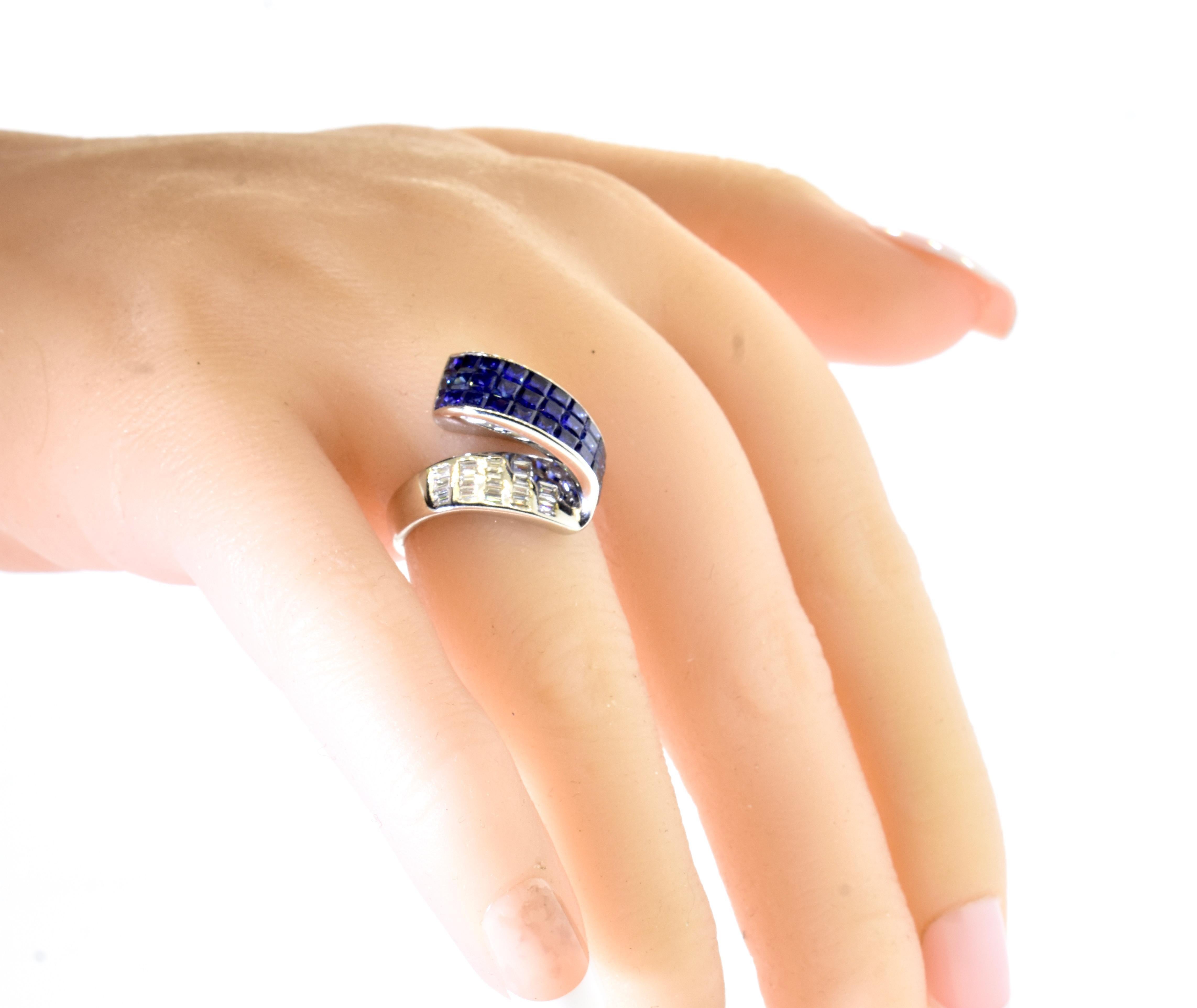 Diamond and Sapphire Contemporary ring. In a scroll like motif or a flowing ribbon and diamonds and sapphires, this unusual and finely made ring possesses invisibly set (one cannot set the metal between the sapphires) natural vivid royal blue