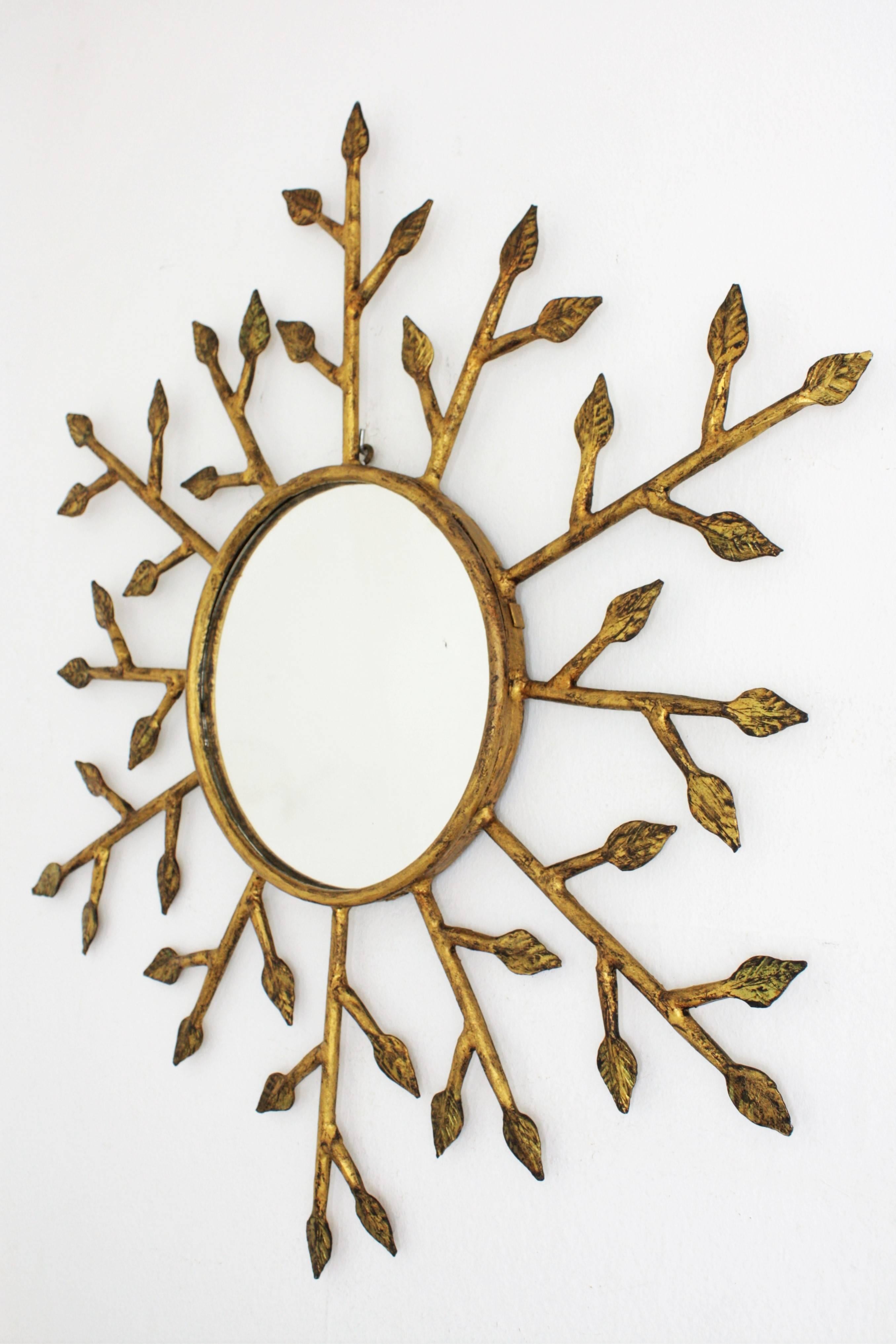 Unusual French 1950s Hand-Hammered Gilt Iron Leafed Wall Sunburst Mirror In Excellent Condition In Barcelona, ES