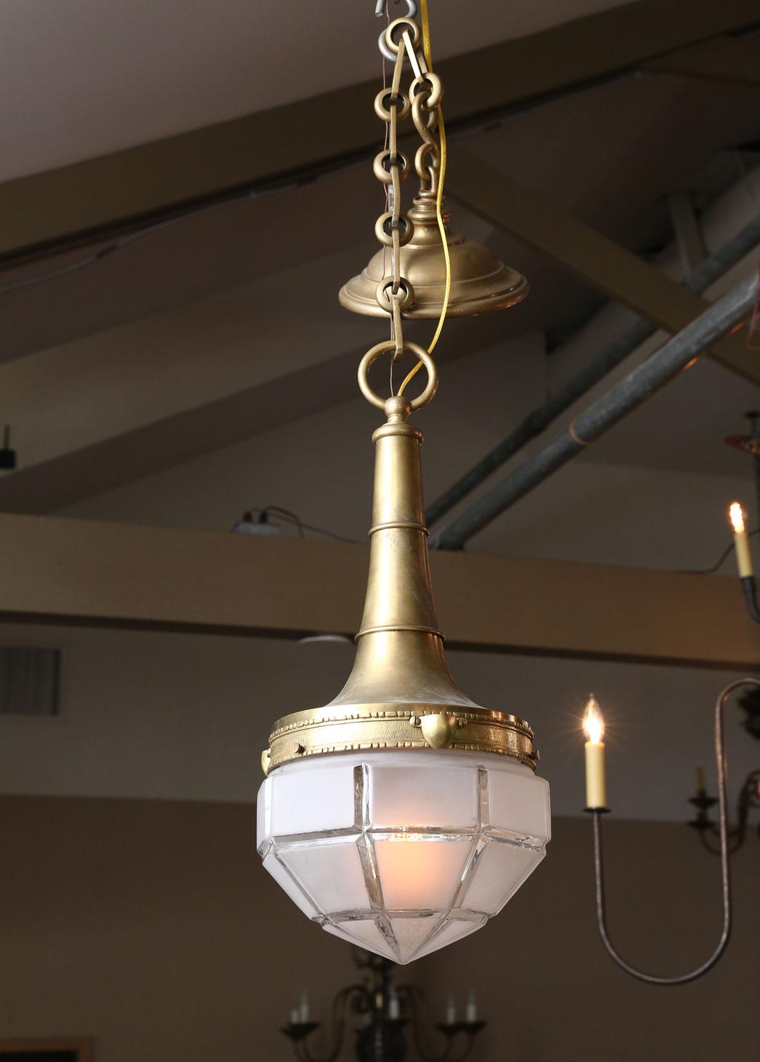 Beautifully cast solid brass and hand blown frosted glass pendant. From France, circa 1930. Art Deco style pendant. Re-wired for the US with UL parts. Very nice quality and a beautiful patina on the brass. Simple, elegant and timeless appeal. Height