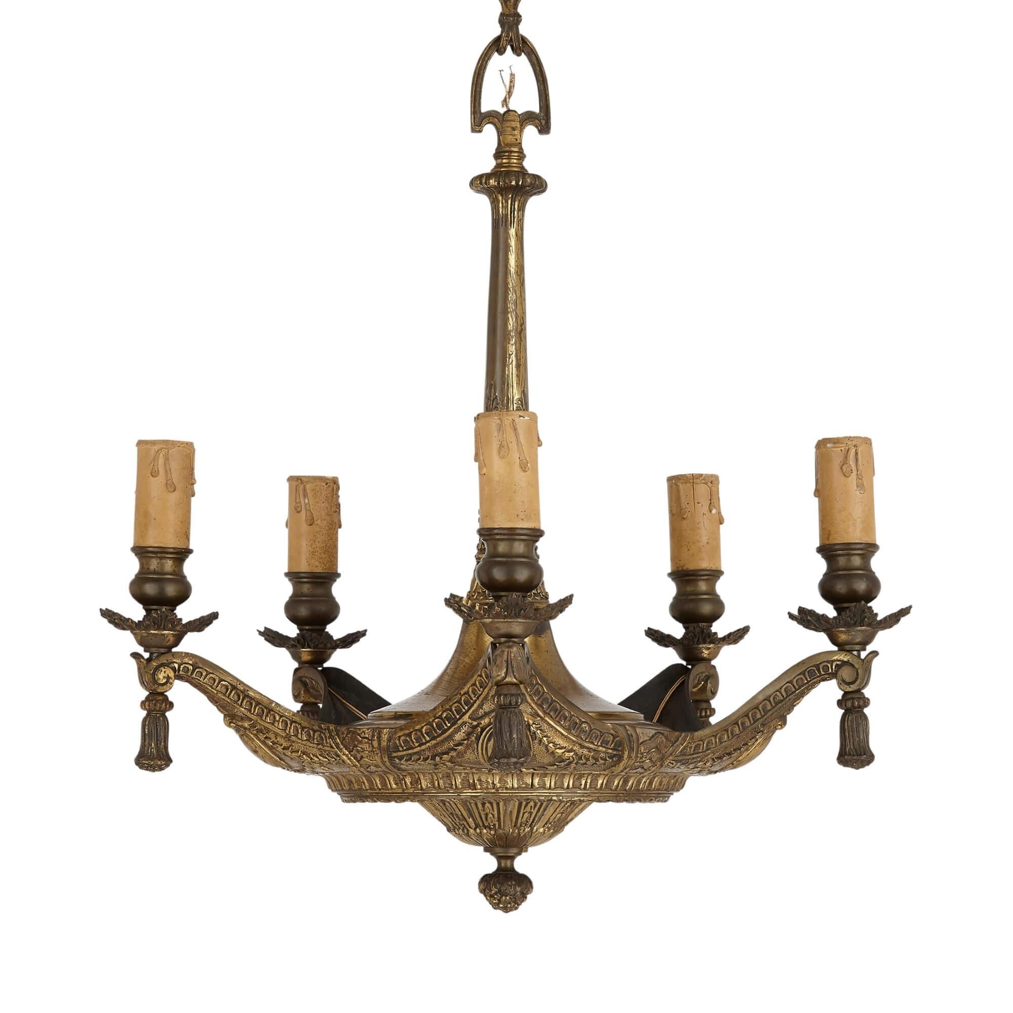 Unusual French gilt bronze cushion-form chandelier
French, late 19th century
Measures: Height 59cm, width 51cm, depth 51cm

This unusual and beautiful gilt bronze chandelier is modelled in a decadent style as a cushion. The chandelier body