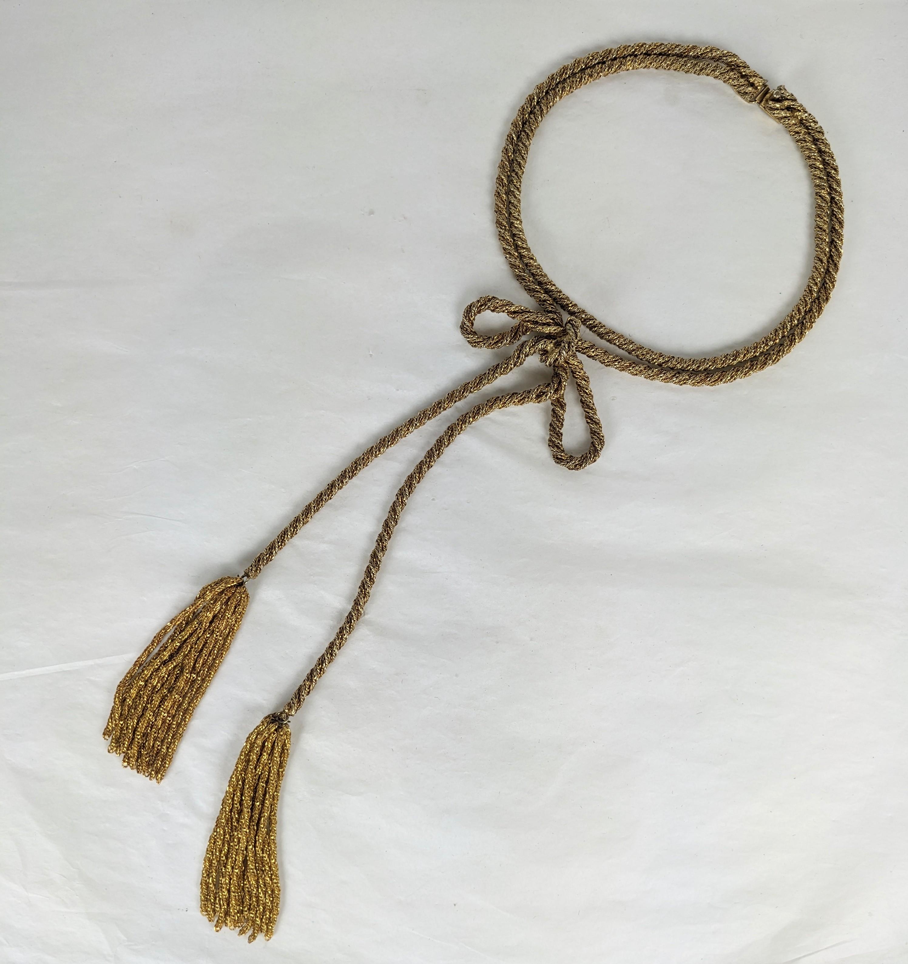 Unusual French Gilt Rope Bow Necklace from the 1950's. Super intricate construction with 2 necklaces attached to one clasp. One is high on neck and the other has a bow with self chain tassels. Each necklace is made of 2 strands of twisted chain to