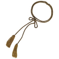 Insolita collana francese con fiocco in corda dorata