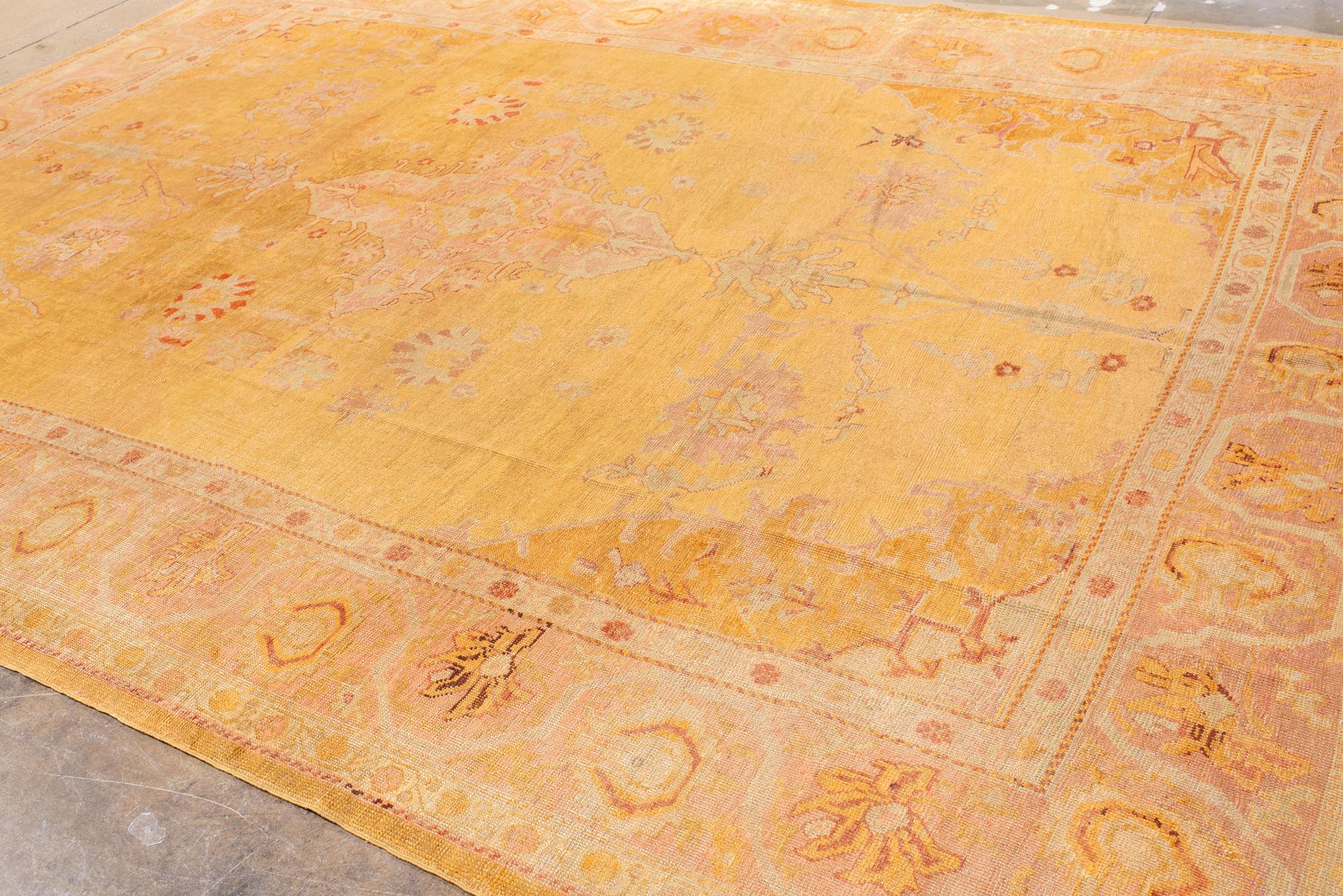 Wool Unusual Gold Antique Oushak with Central Medallion For Sale