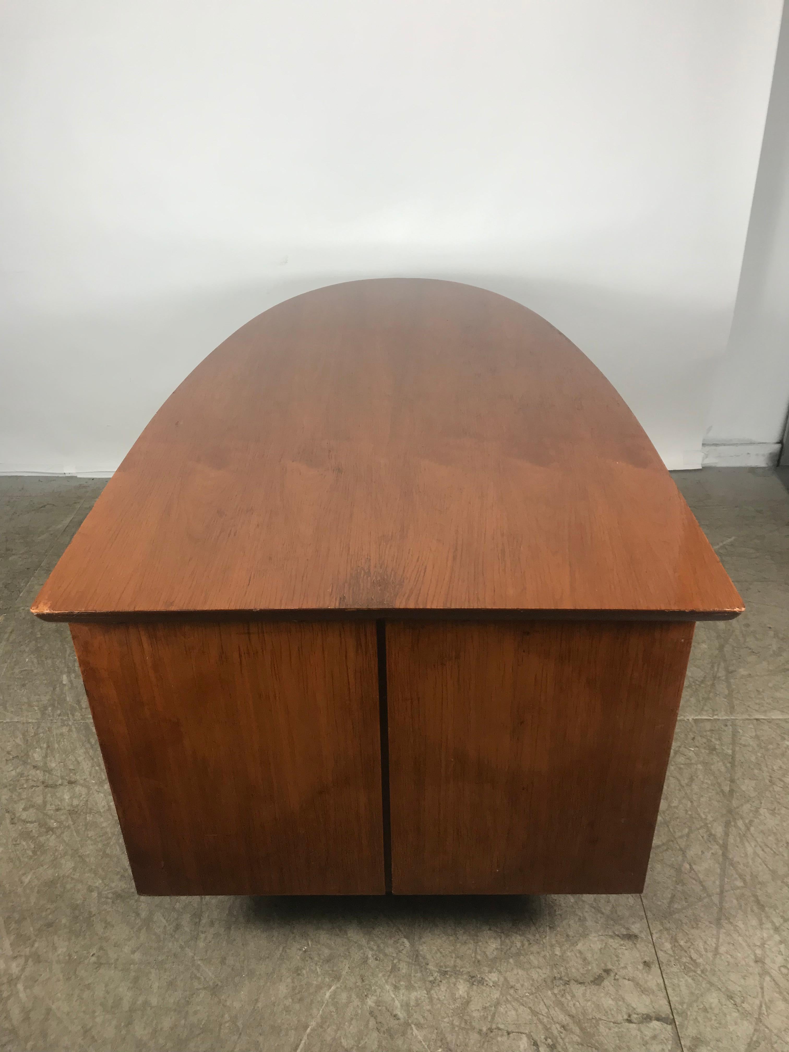 Unusual half oval shaped walnut partners desk by Miller Desk & Safe Co, half oval top, caned modesty panel, striking metal 