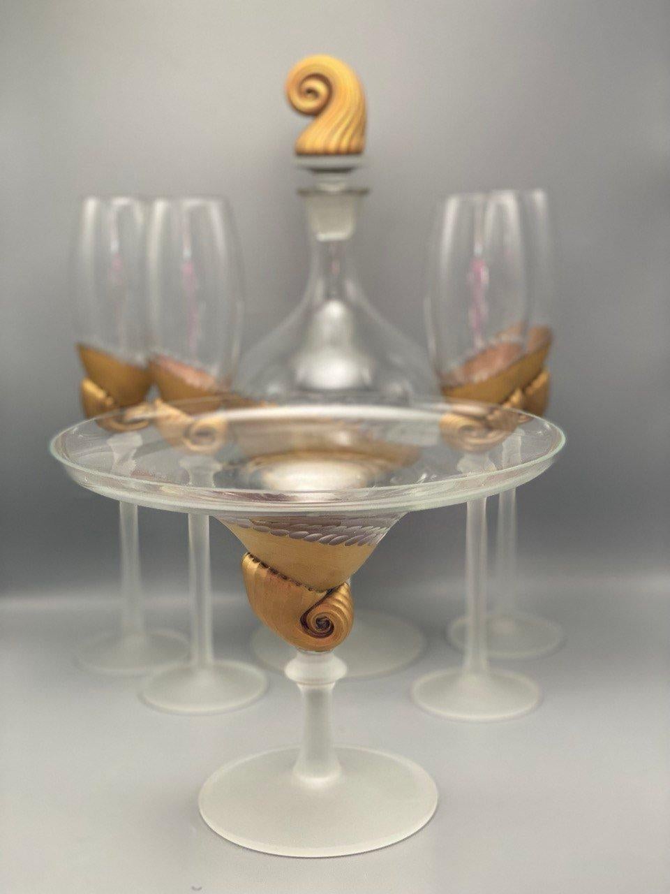 Absolutely Antique crystal tableware set.

This charming set of 6 pieces includes a Decanter, 4 matching goblets and a candy dish.

Crystal glasses are the most original and interesting type of containers for drinks. They are used on solemn