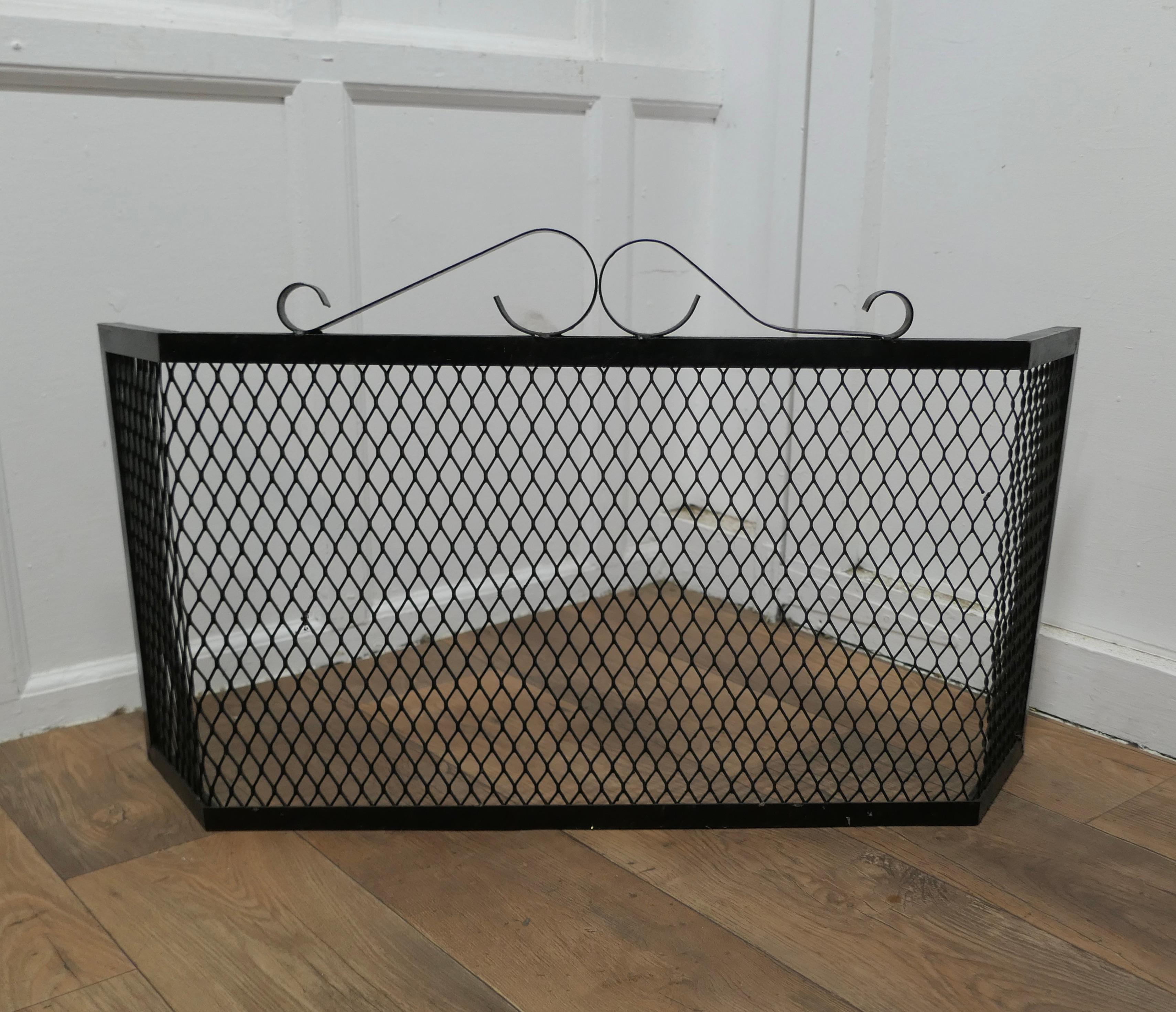 Unusual Heavy Iron Fire Guard 

This is an unusual Fireguard, the guard is made in Iron, both the frame and the mesh, it has a shaped front to enclosed the fire
The guard is in good condition and very steady when in use
The guard is 22” high, it is