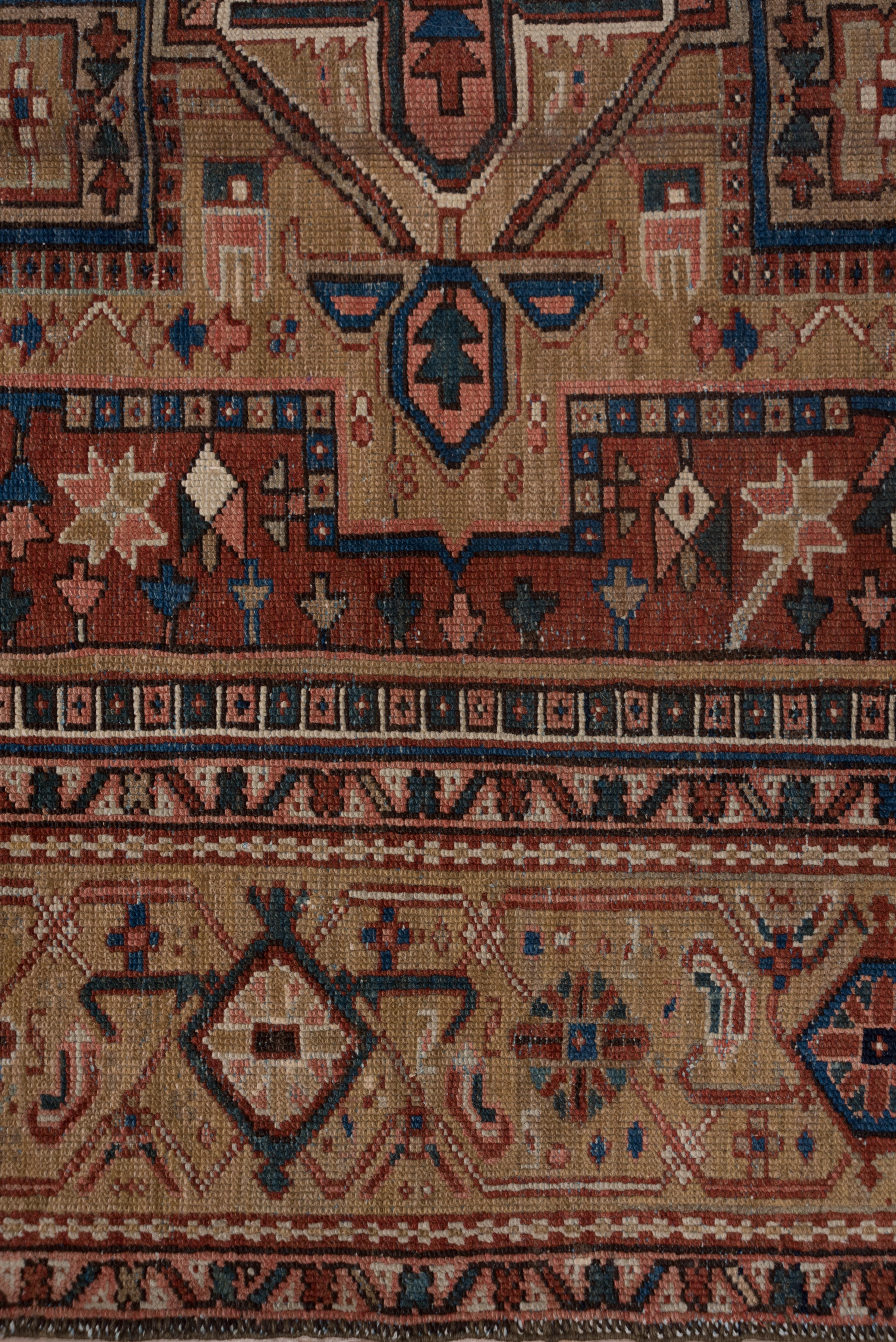 A single-wefted carpet with a Classic pendanted octogramme mustard medallion on a red, stepped Sub field and middle blue field manifested in the geometric flower corners. The mustard border features the simplest of widely spaced turtle palmettes.