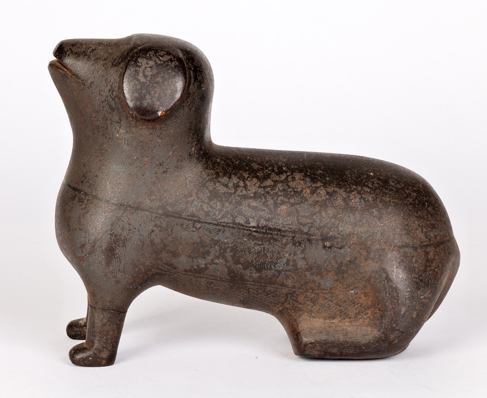 Molded Unusual Indian Khond Attributed Stylized Patinated Metal Seated Dog Figure For Sale