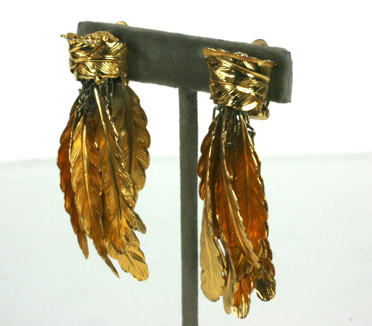 Unusual and  striking Italian Gilt Feather Earrings from the 1980's. A gilt feather is wrapped around a gold 