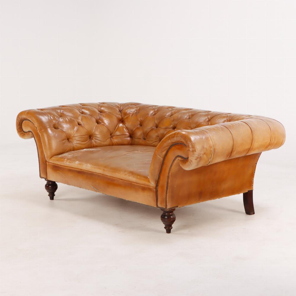 Unusual Italian leather Chesterfield style sofa with extra deep frame C 1930 with extra deep frame, flaring arms, and button back upholstery all resting on turned legs. The depth of this frame is very rare. The seat does have some wear and as it is
