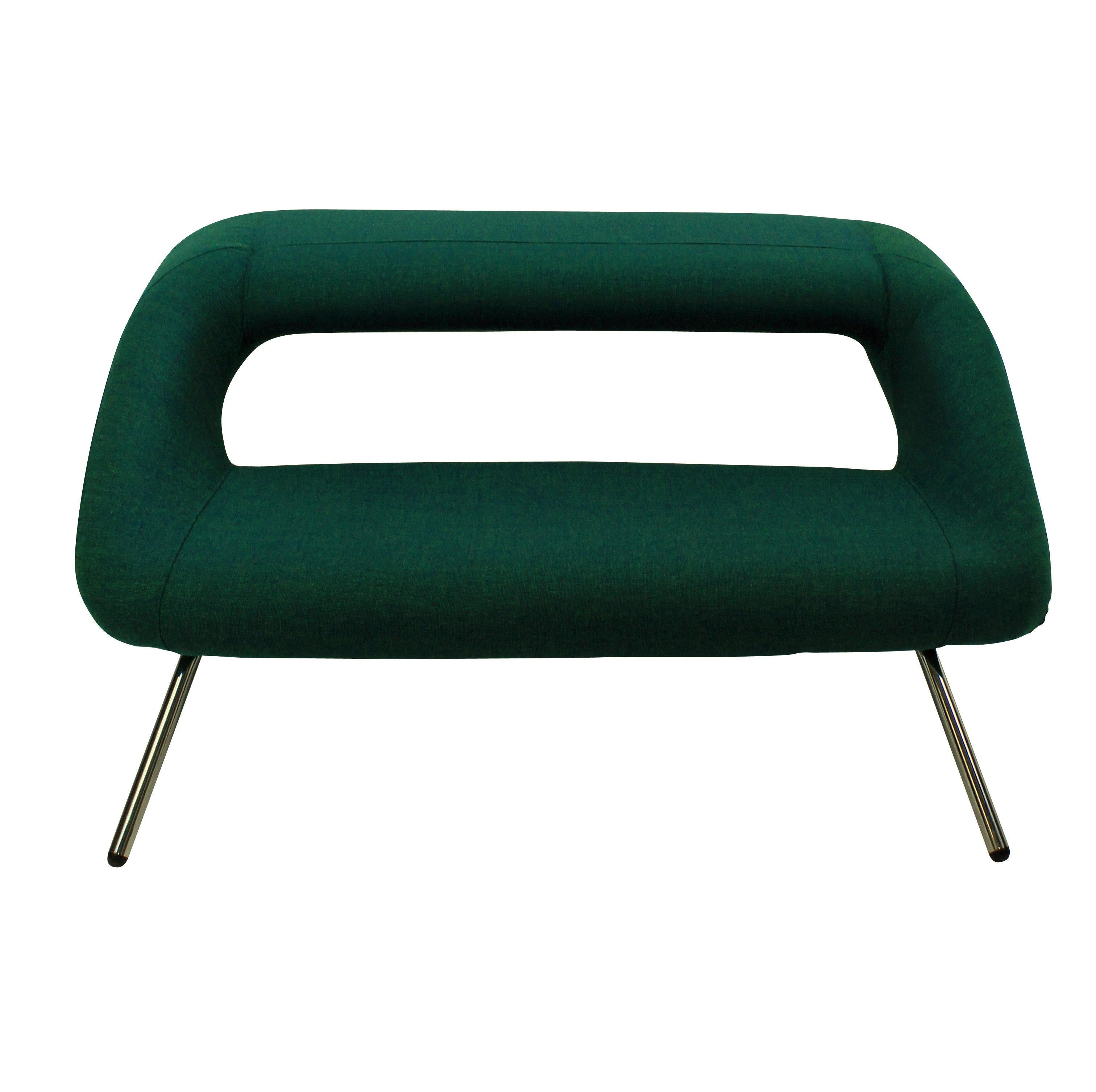 An unusual Italian modernist sofa. Of interesting design, newly upholstered in emerald Bute and on chrome legs.
This sofa despite its appearance is remarkable comfortable. The top can be used to rest a drinks tray or books.
  