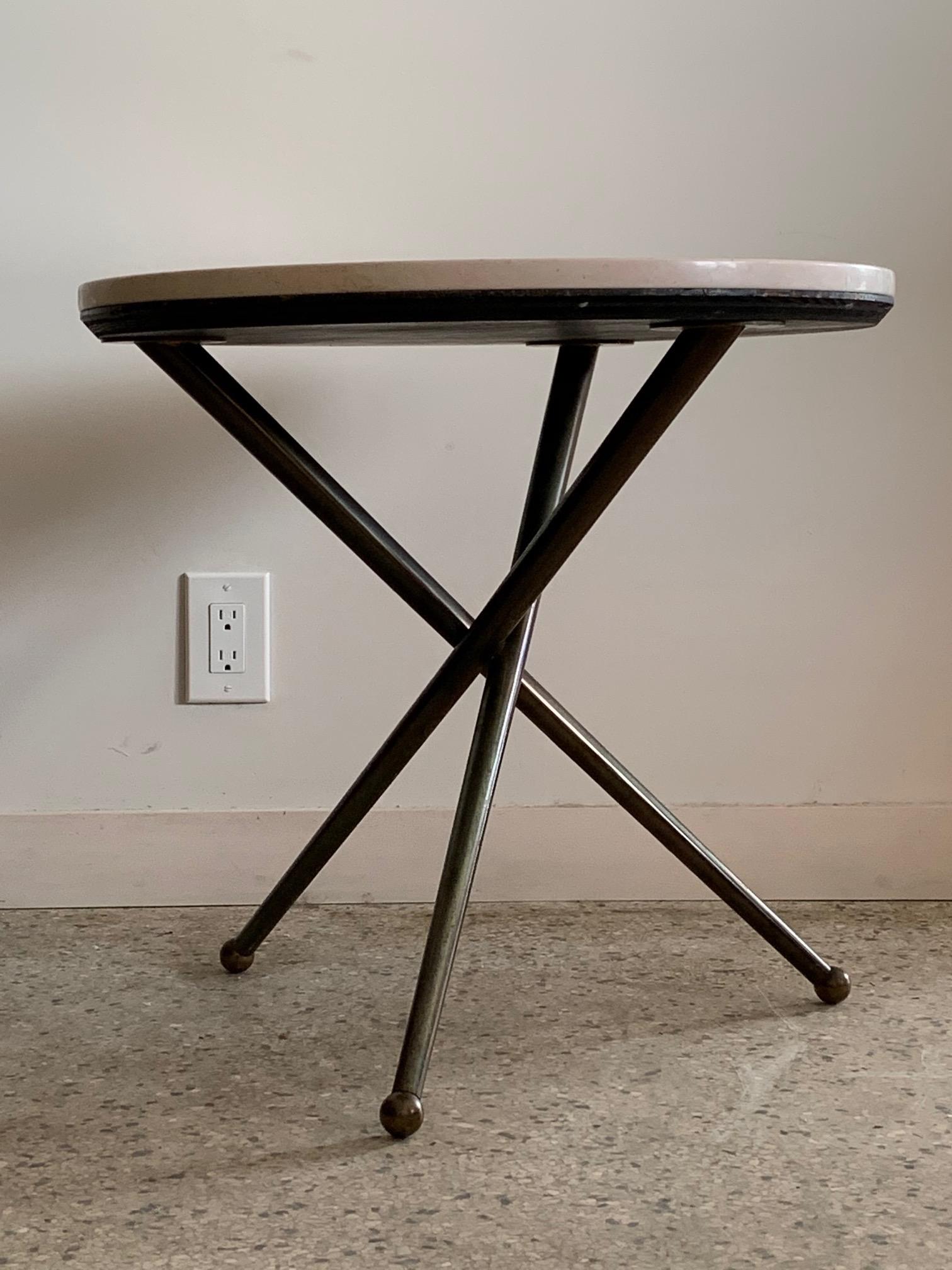 A beautiful and elegant Italian gueridon-three legged table with patinated brass base and marble top. 
Well made and heavy this could be a side or lamp table.