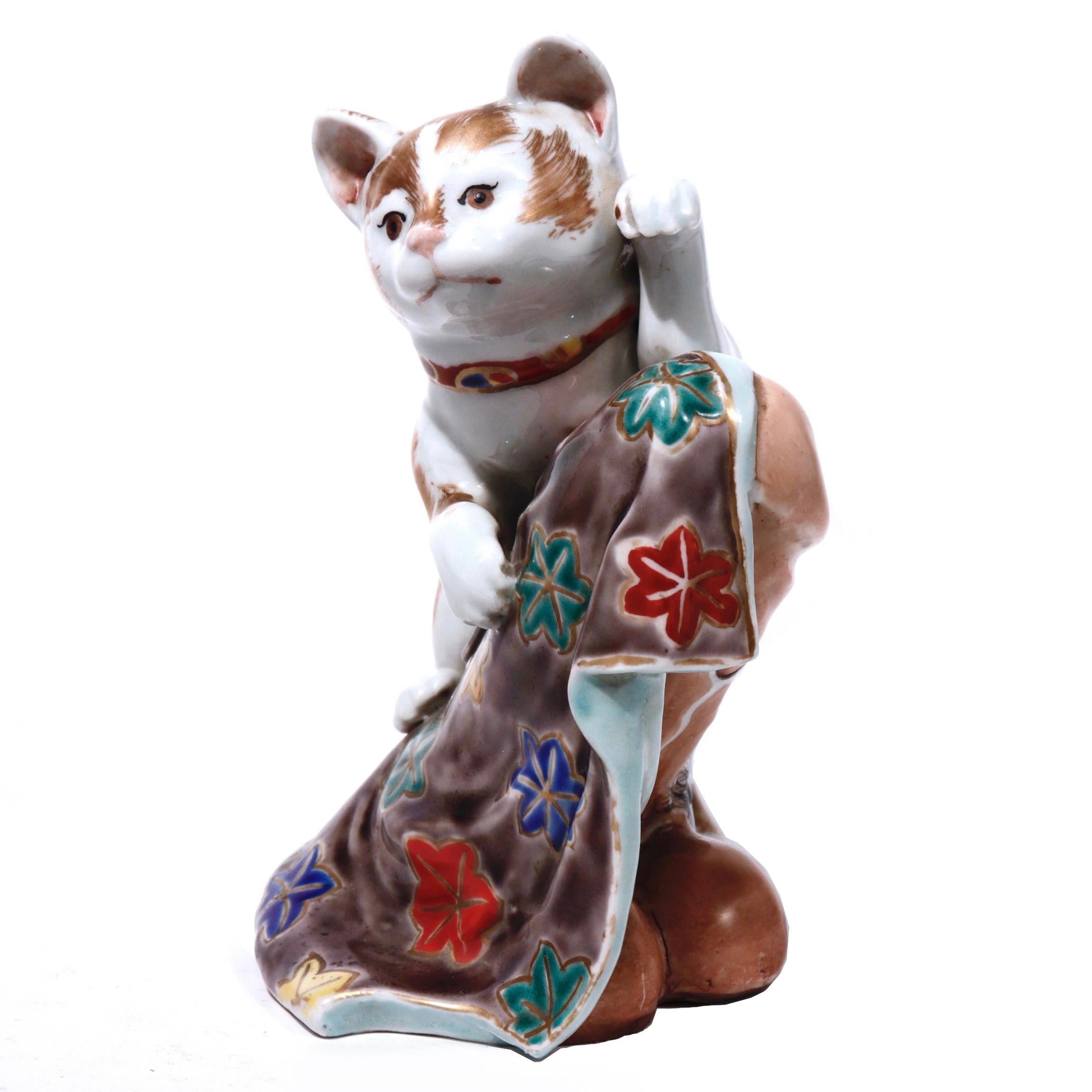 Unusual Japanese porcelain figural sculpture, Kutani style, of a provocative rendition of Maneki Neko the good luck beckoning shop cat combined with a partially covered phallus, together a wish for good fortune and fertility/strength/union, the cat