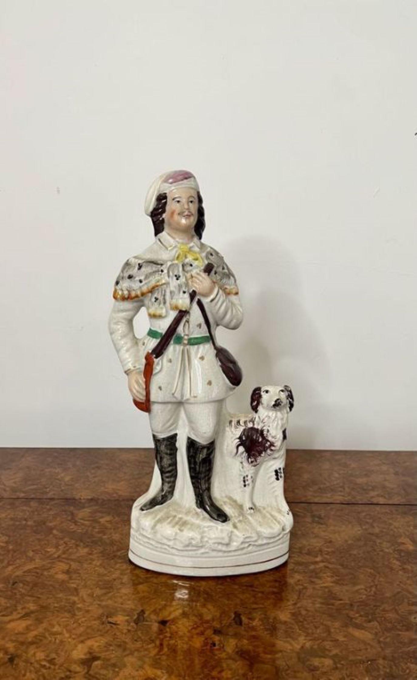 Unusual large antique Victorian Staffordshire figure having an unusual large antique Victorian Staffordshire figure of a man in traditional clothing with his dog at his side hand painted in white, gold, green, yellow, pink and brown colours standing