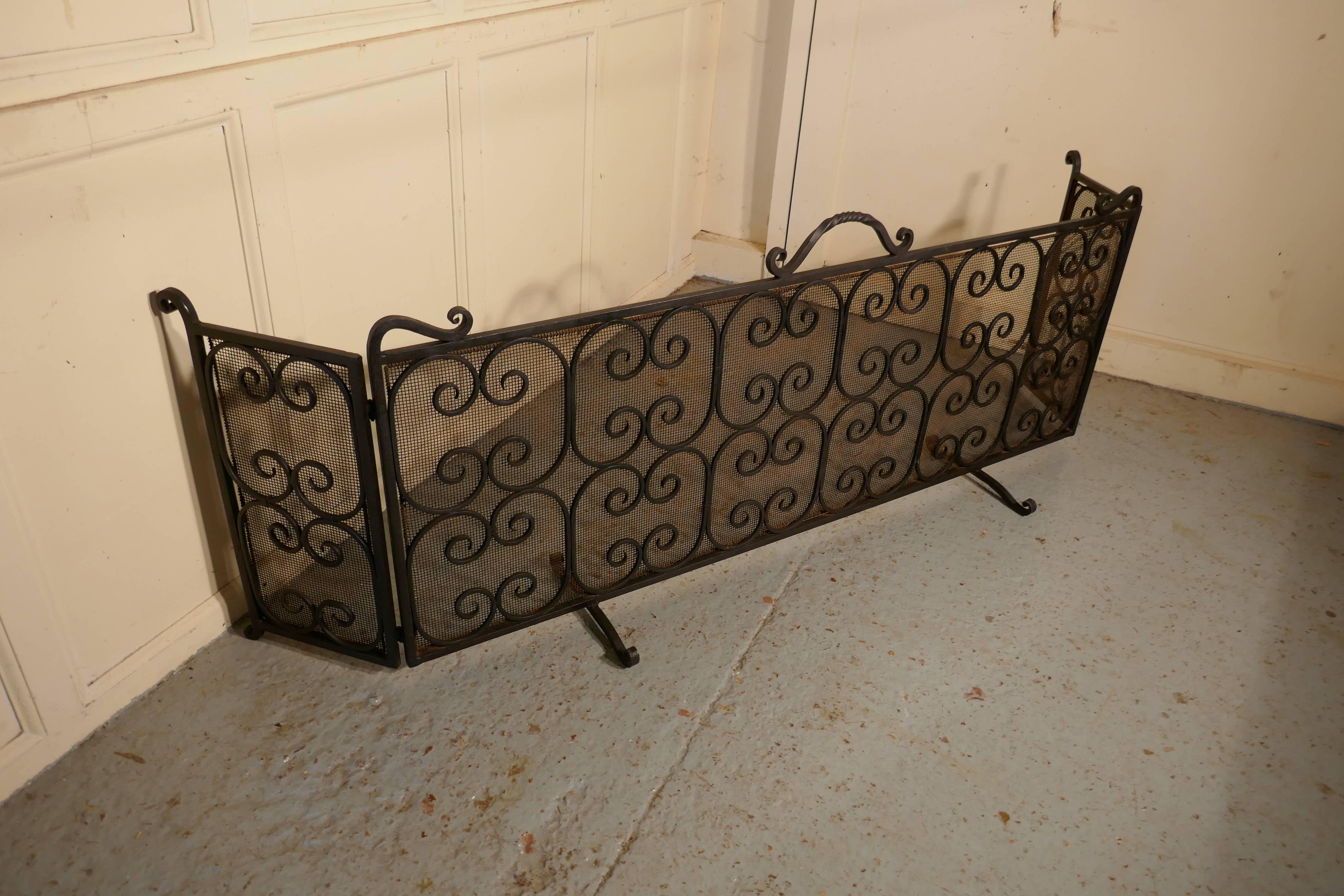 Unusual large folding wrought iron fire guard for Inglenook Fireplace

This is an unusually large fireguard, it has been specially made for a traditional Inglenook fireplace as it will completely surround the fire. The guard has an iron frame with