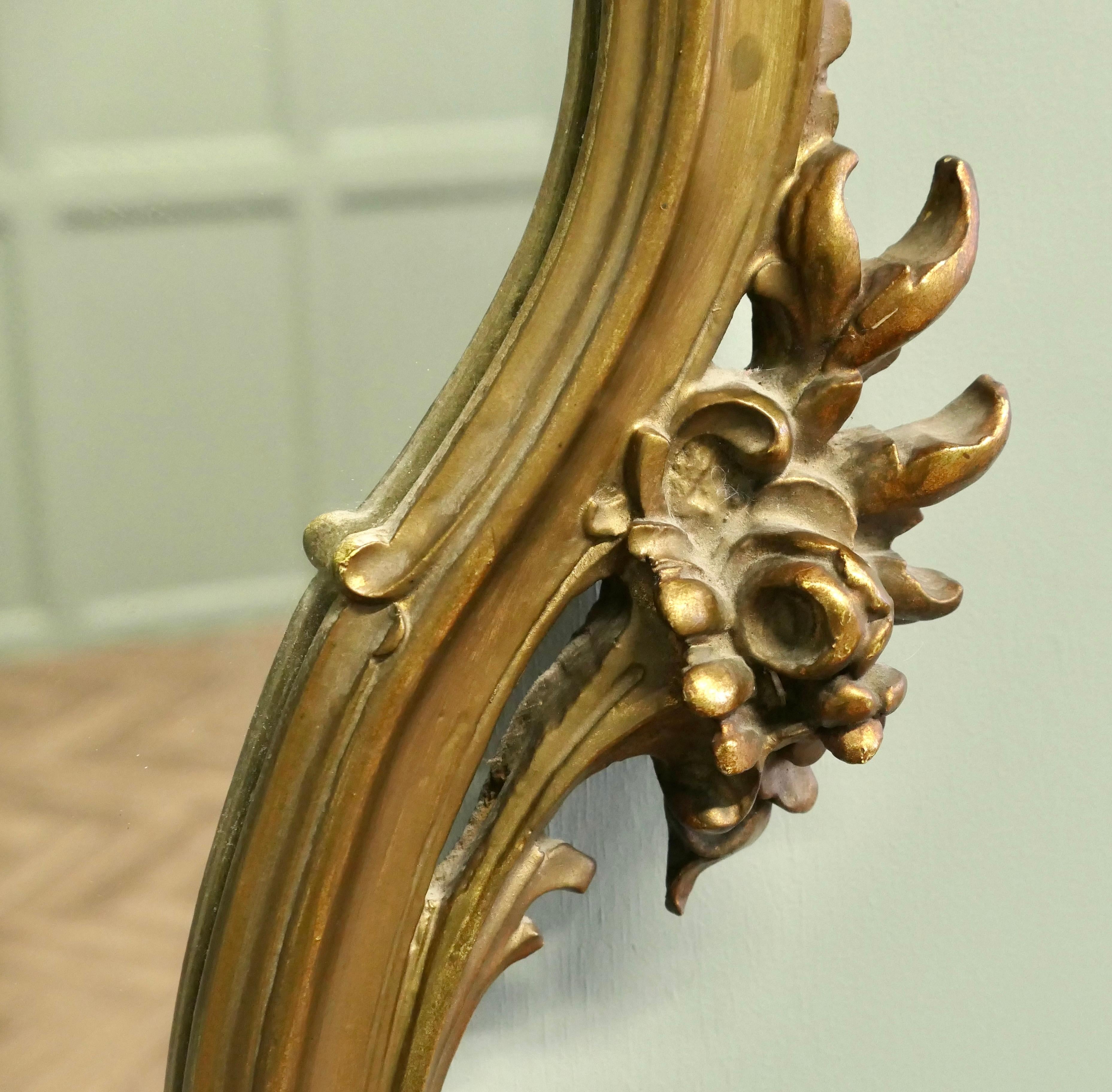 Rococo Revival Unusual Large Rococo Style Gilt Wall Mirror  The Mirror has an elaborate shape For Sale