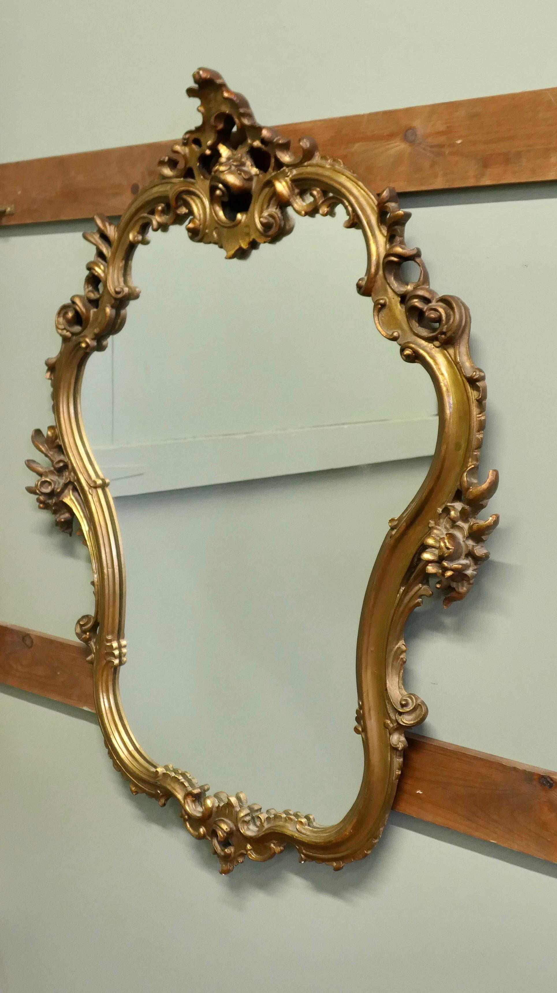 Gesso Unusual Large Rococo Style Gilt Wall Mirror  The Mirror has an elaborate shape For Sale
