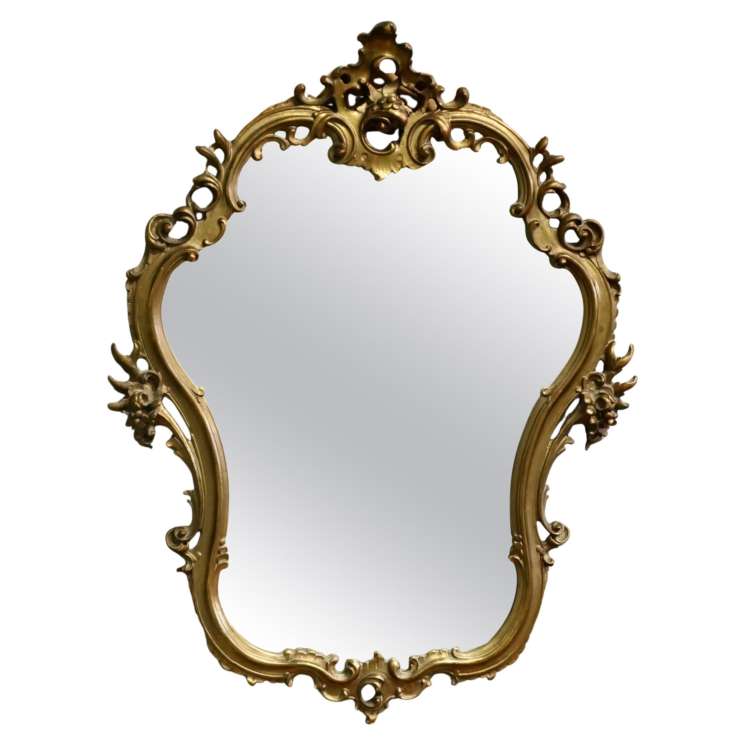 Unusual Large Rococo Style Gilt Wall Mirror  The Mirror has an elaborate shape For Sale