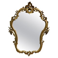 Unusual Large Rococo Style Gilt Wall Mirror  The Mirror has an elaborate shape