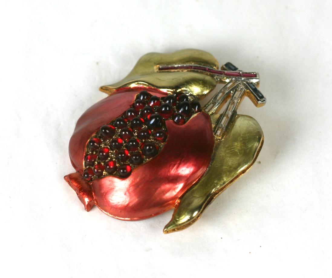 Rare Marcel Boucher pomegranate brooch of gold plated metal with signature pearlized enamel. Set with vari sized faux ruby bullet cabocheons with faux ruby, crystal and sapphire calibre set baguettes.
Excellent Condition, Unsigned.
Length 2