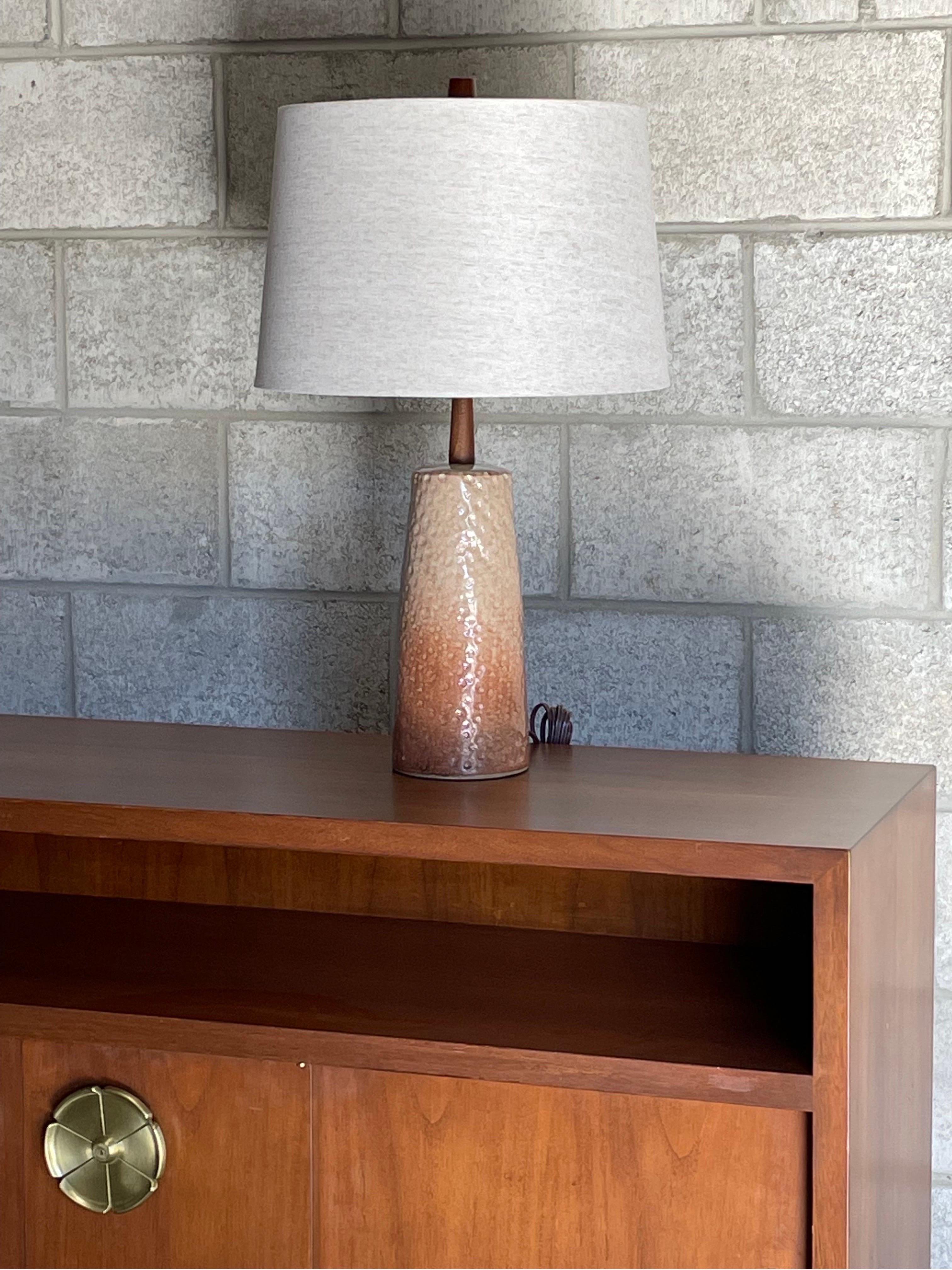 Table lamp by ceramicist duo Jane and Gordon Martz for Marshall Studios. Blush rose colored with interesting and unusual dimple detail similar to a golfball. Unique design adds great movement and depth to the lamp.

 Measures: 
Overall 
24.5”